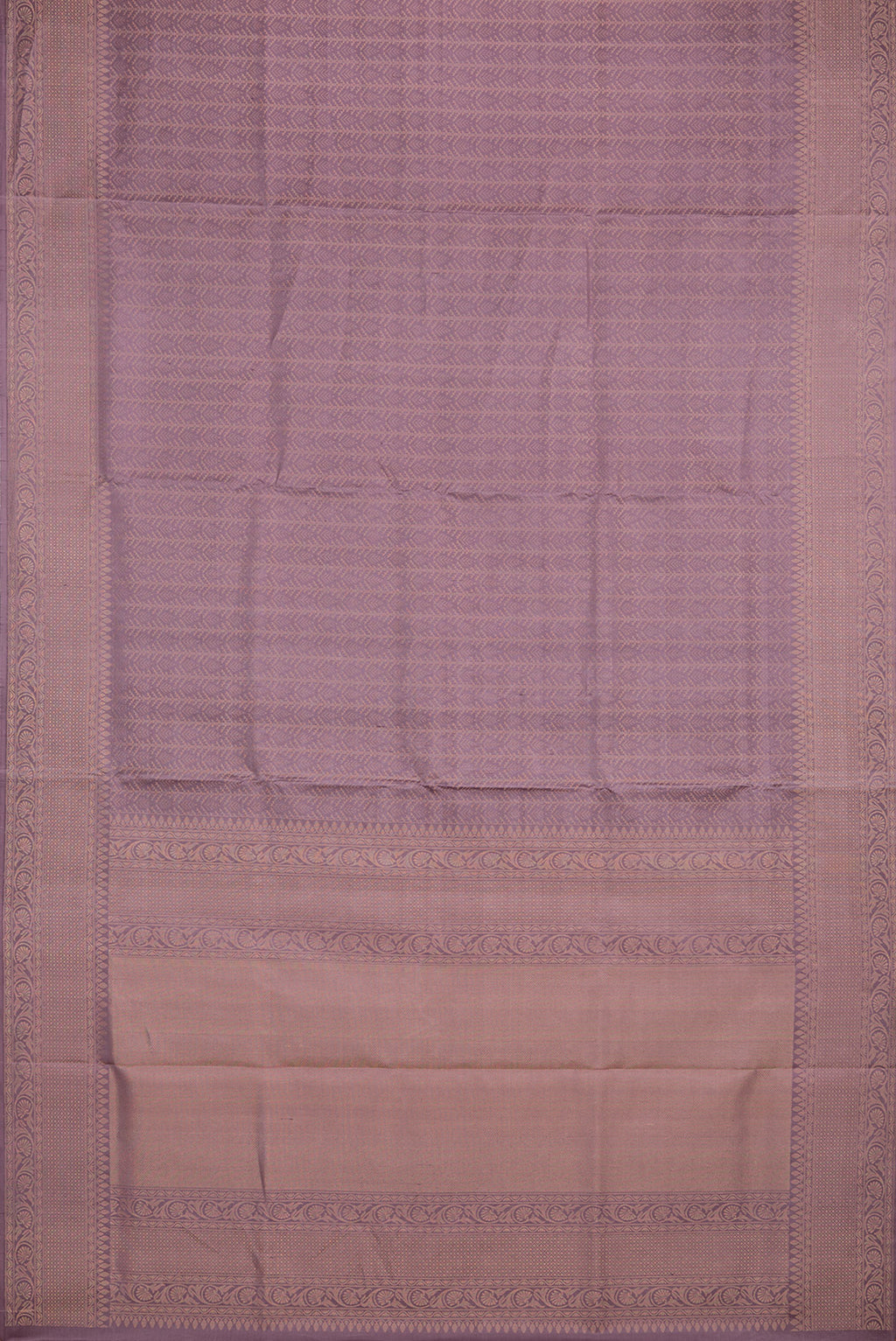 Flat view of Pure Silk Mauve Soft Saree with Zari Brocade on the body and Fancy Border. 