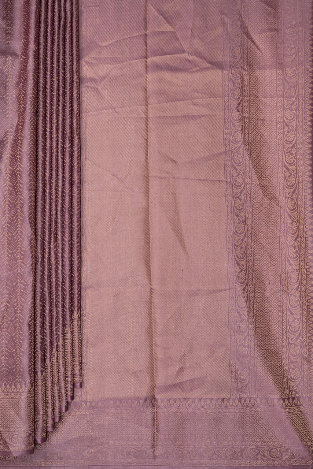 Pleats and pallu of Pure Silk Mauve Soft Saree with Zari Brocade on the body and Fancy Border. 
