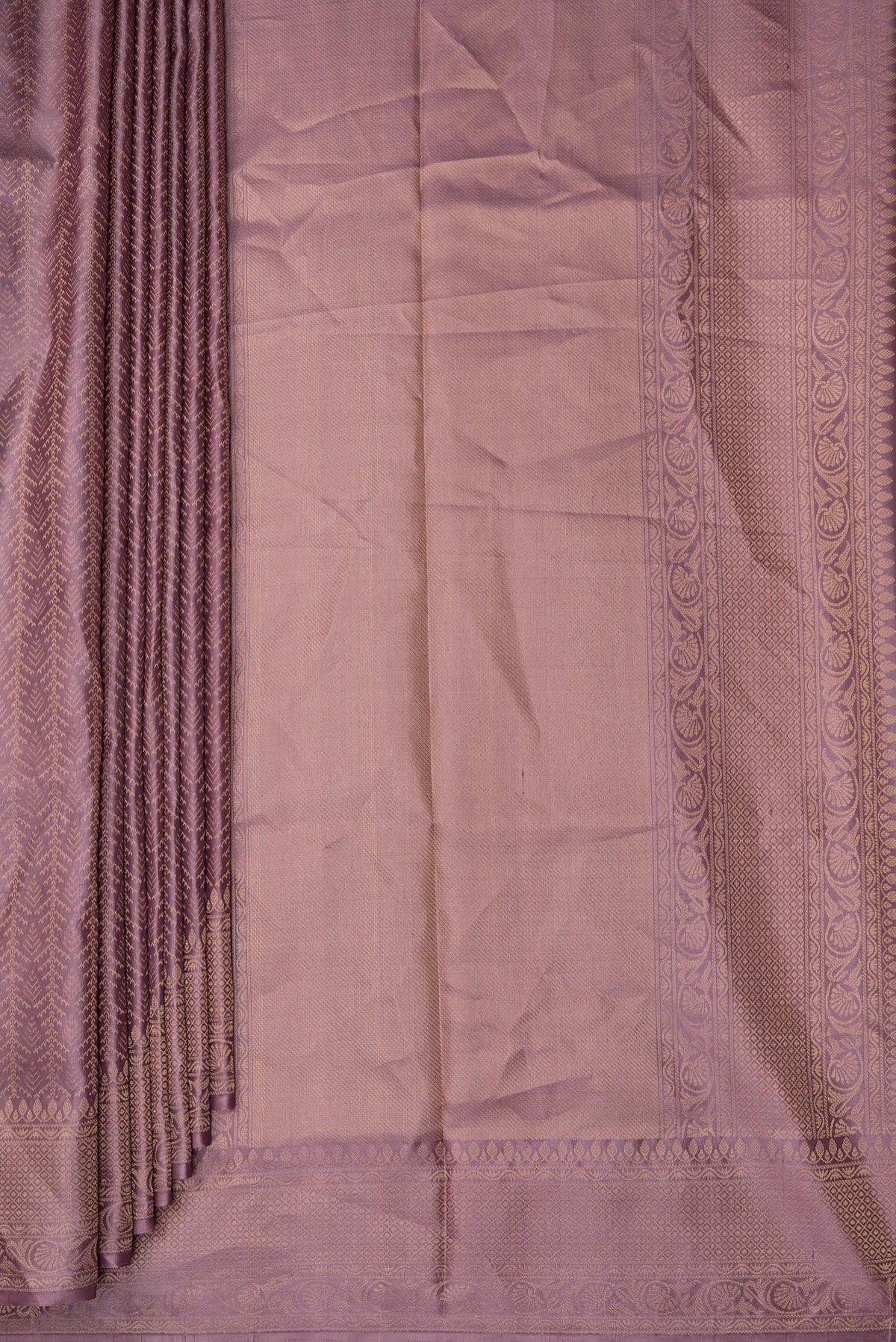 Pleats and pallu of Pure Silk Mauve Soft Saree with Zari Brocade on the body and Fancy Border. 