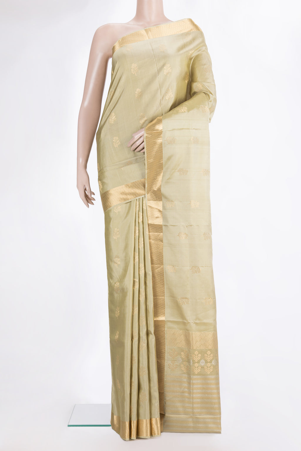 Pure Silk Beige Soft Saree with Zari Butta on the body and Zari Border.  displayed on a mannequin