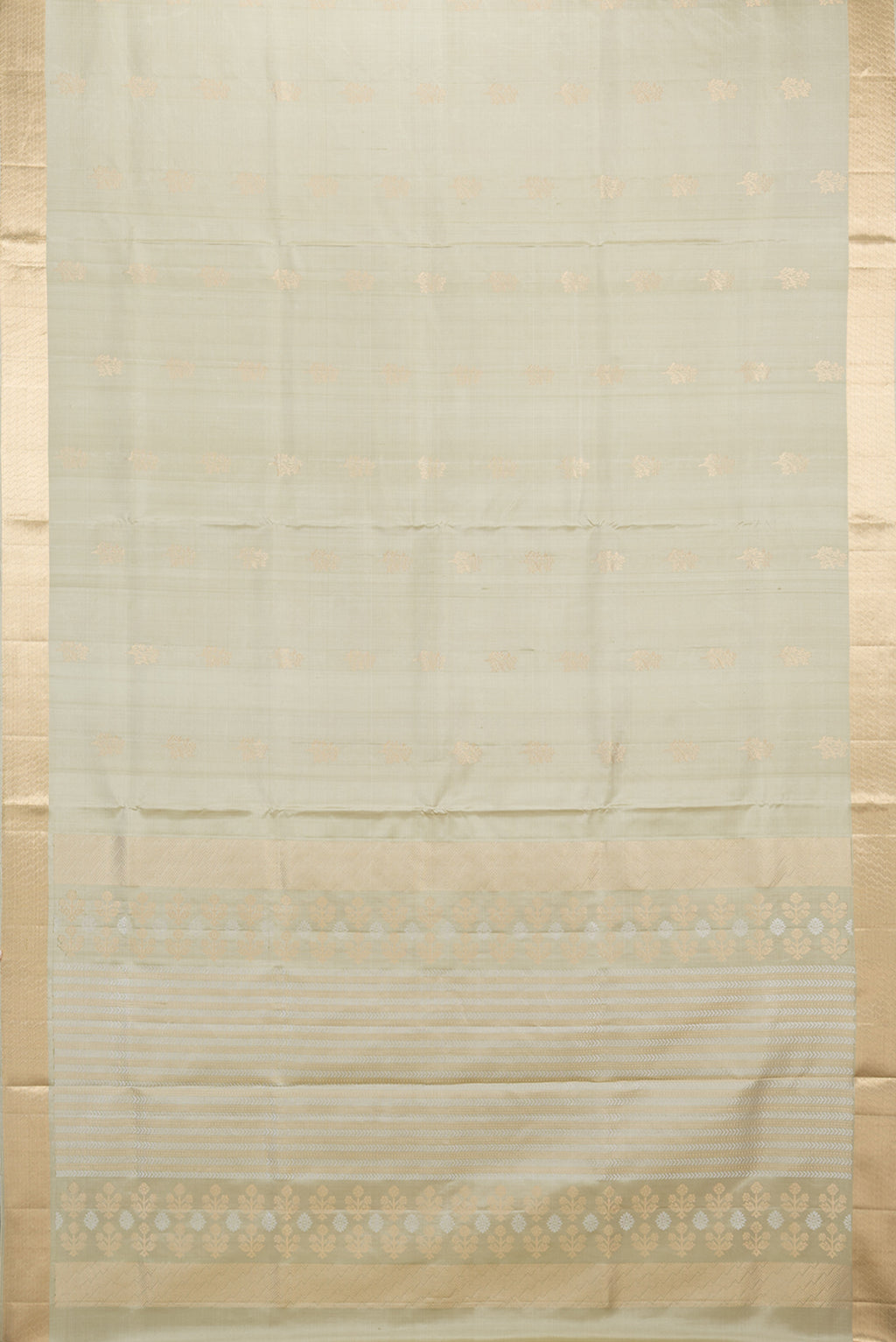 Flat view of Pure Silk Beige Soft Saree with Zari Butta on the body and Zari Border. 