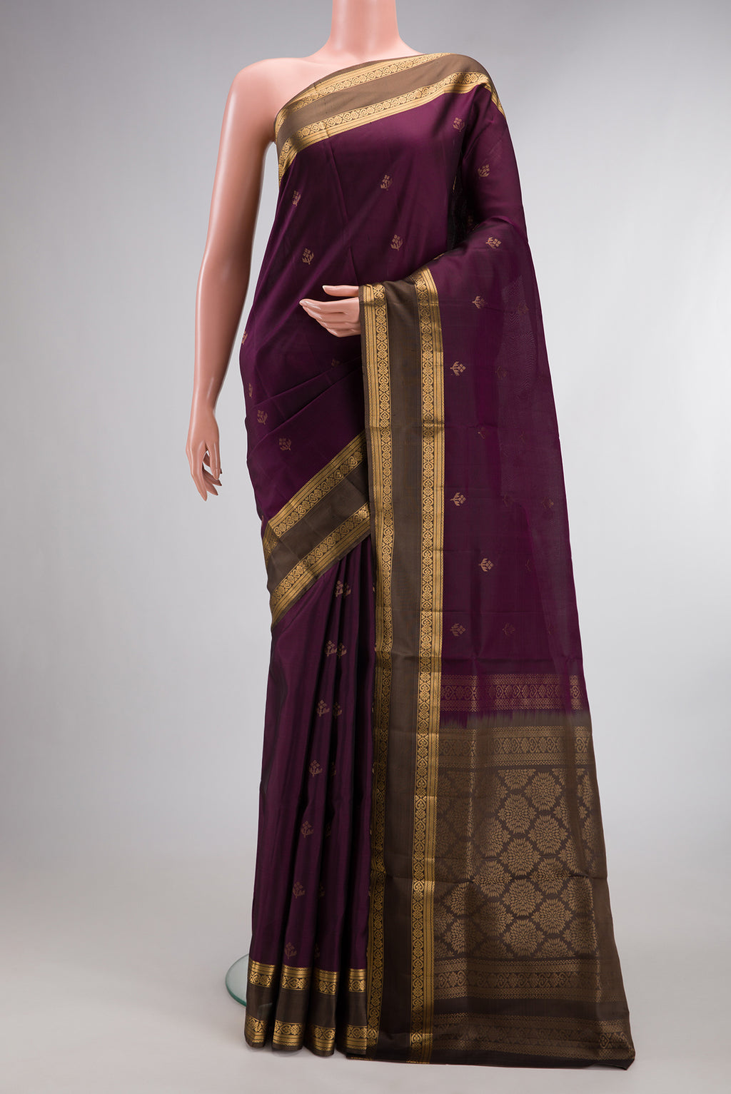 Pure Silk Burgundy Soft Saree with Zari Butta on the body and Zari Border.  displayed on a mannequin