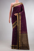 Pure Silk Burgundy Soft Saree with Zari Butta on the body and Zari Border.  displayed on a mannequin