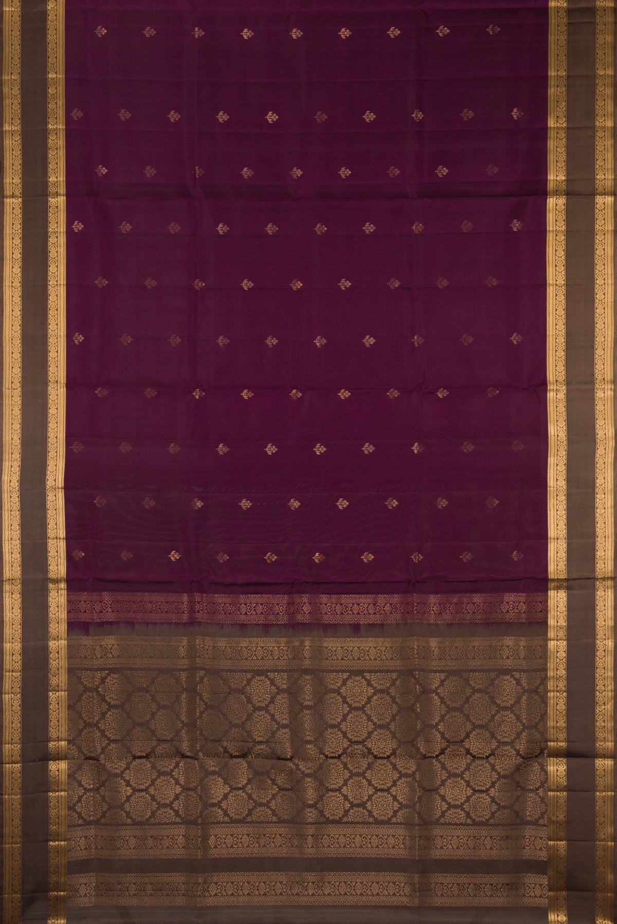 Flat view of Pure Silk Burgundy Soft Saree with Zari Butta on the body and Zari Border. 