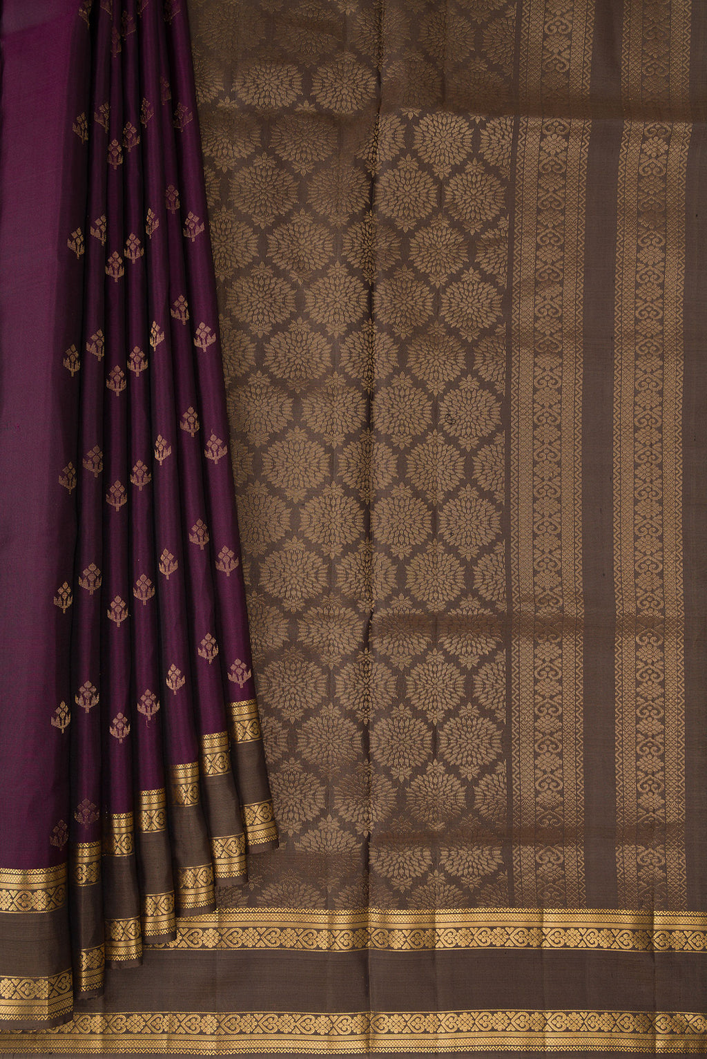 Pleats and pallu of Pure Silk Burgundy Soft Saree with Zari Butta on the body and Zari Border. 