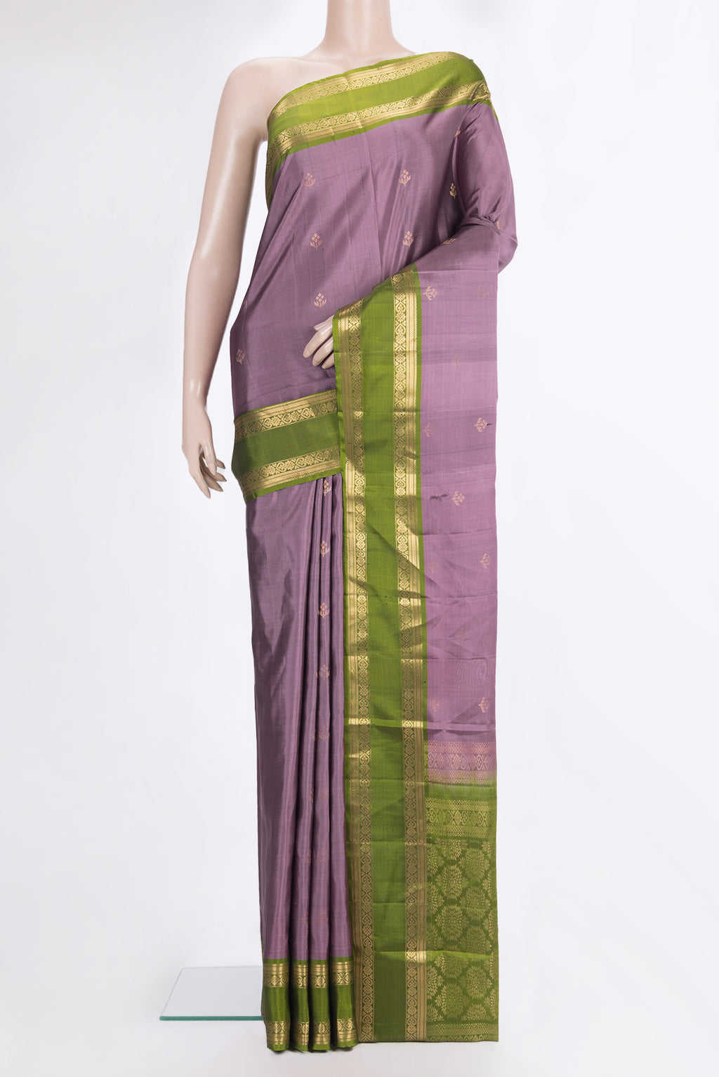 Pure Silk Mauve Soft Saree with Zari Butta on the body and Zari Border.  displayed on a mannequin