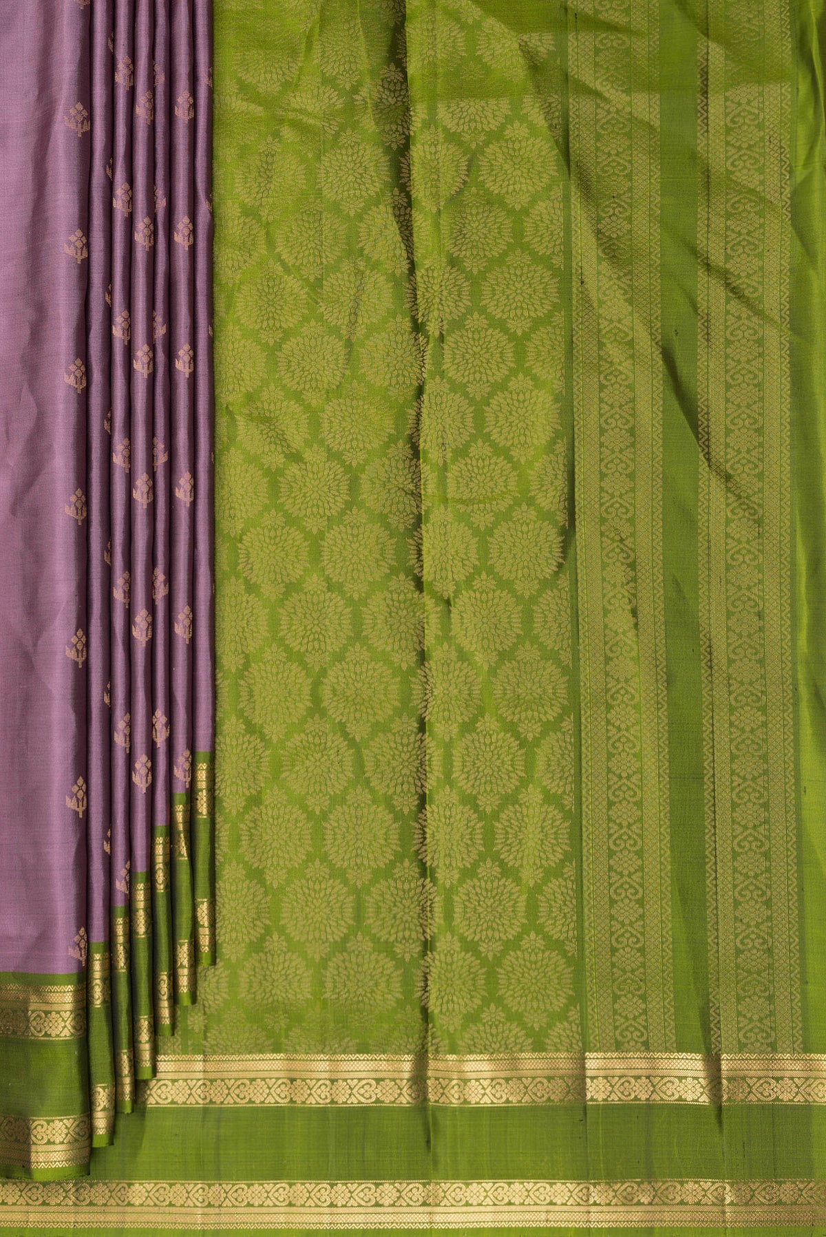 Pleats and pallu of Pure Silk Mauve Soft Saree with Zari Butta on the body and Zari Border. 