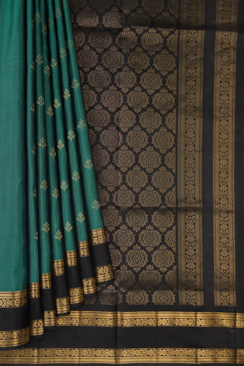 Pleats and pallu of Pure Silk Green Soft Saree with Zari Butta on the body and Zari Border. 