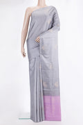 Pure Silk Grey Soft Saree with Zari Butta on the body and Without Border.  displayed on a mannequin