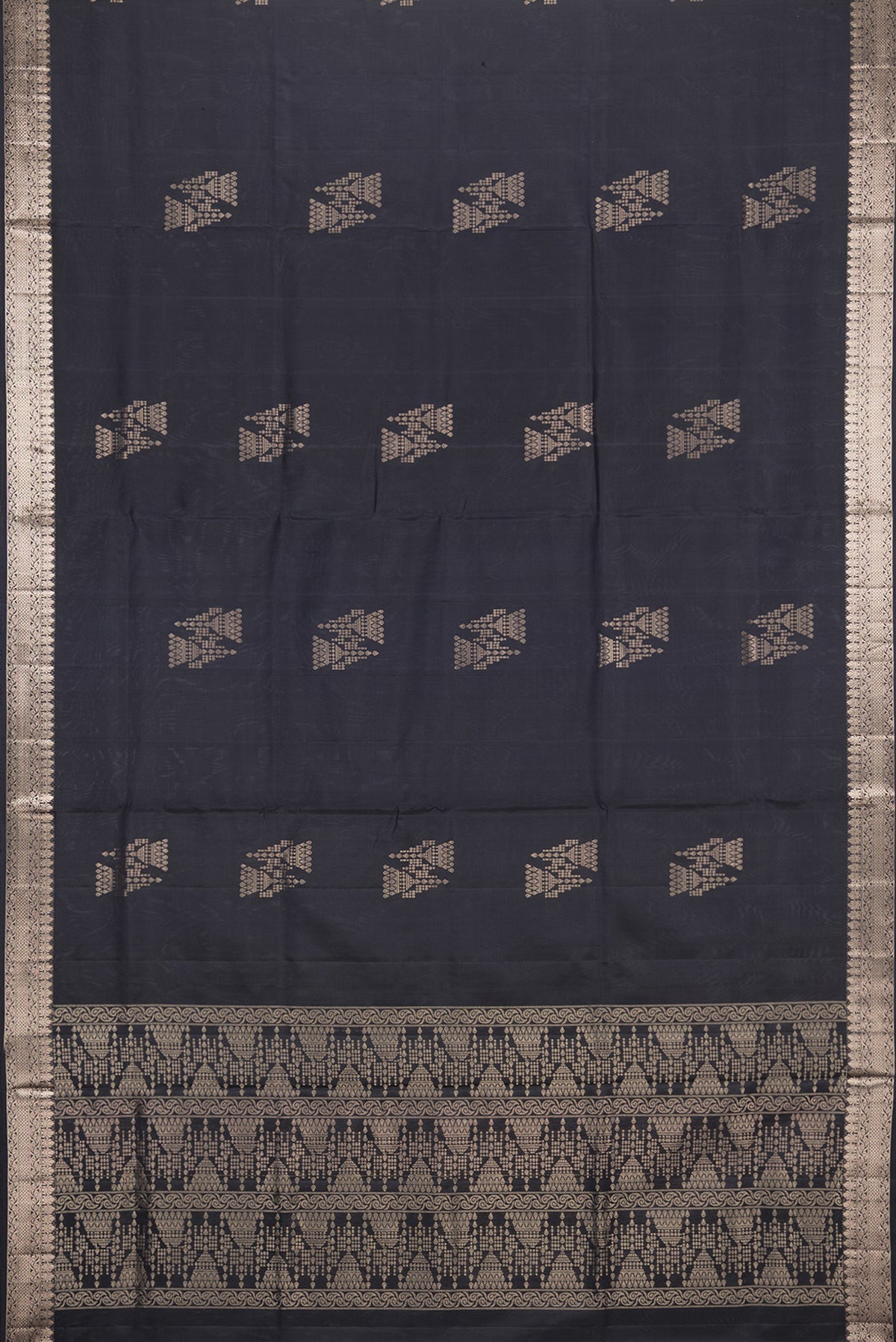 Flat view of Pure Silk Black Soft Saree with Zari Butta on the body and Zari Border. 