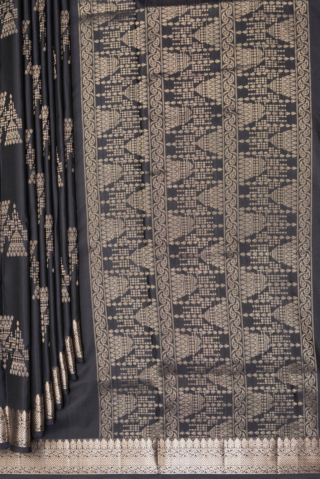 Pleats and pallu of Pure Silk Black Soft Saree with Zari Butta on the body and Zari Border. 