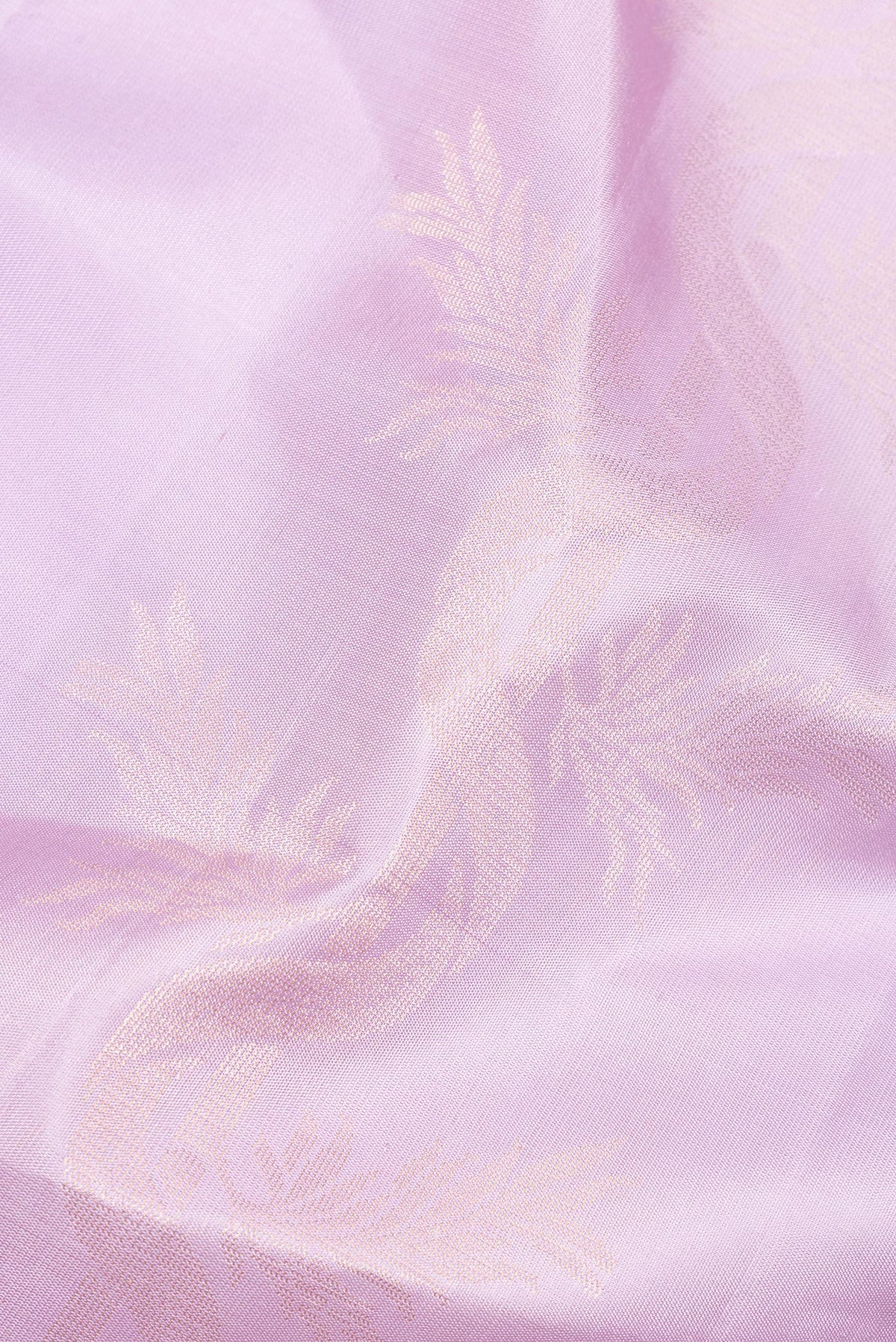 Close up of Pure Silk Lavender Soft Saree with Zari Butta on the body and Without Border.  displaying folds