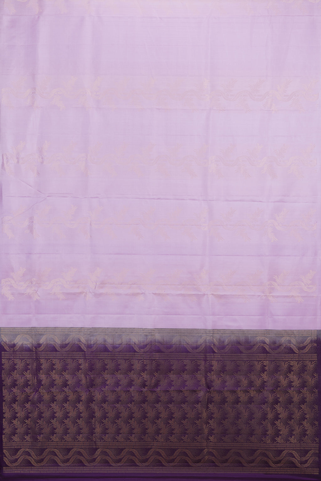 Flat view of Pure Silk Lavender Soft Saree with Zari Butta on the body and Without Border. 