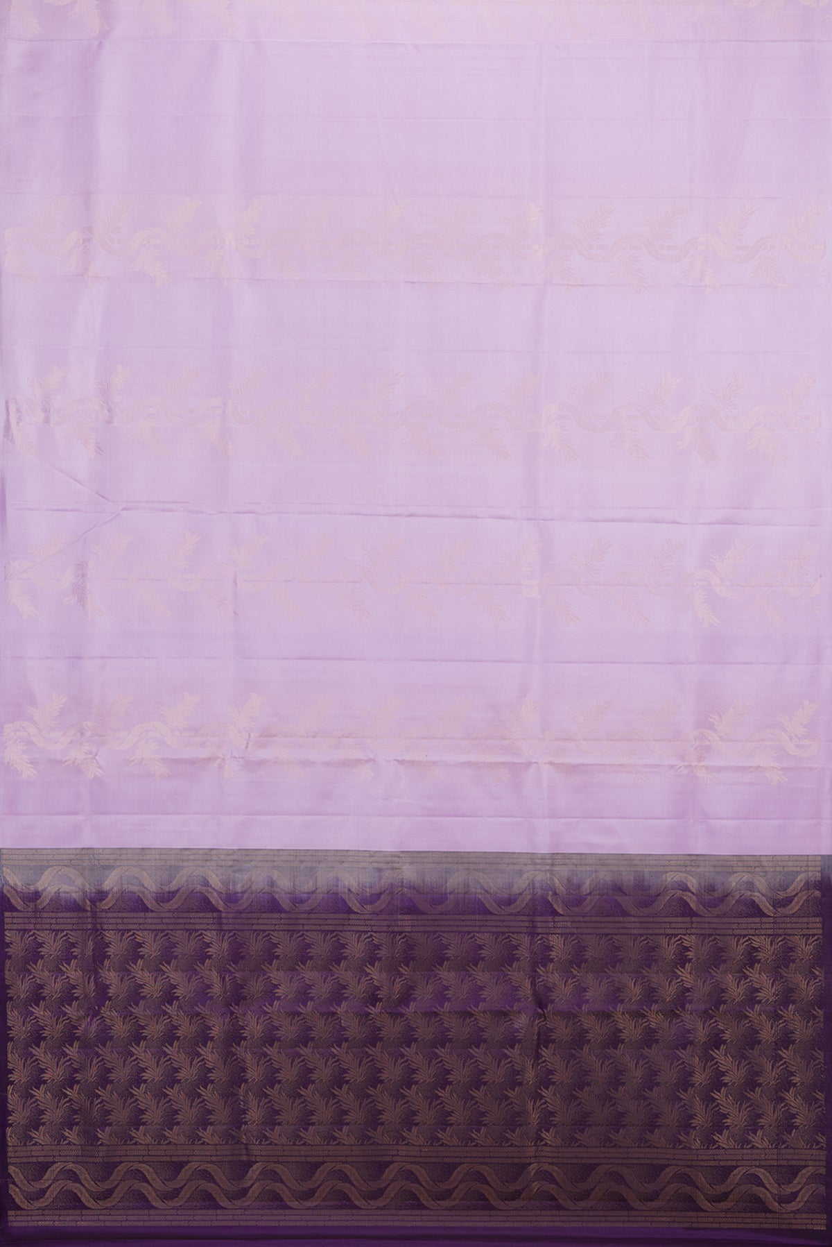Flat view of Pure Silk Lavender Soft Saree with Zari Butta on the body and Without Border. 