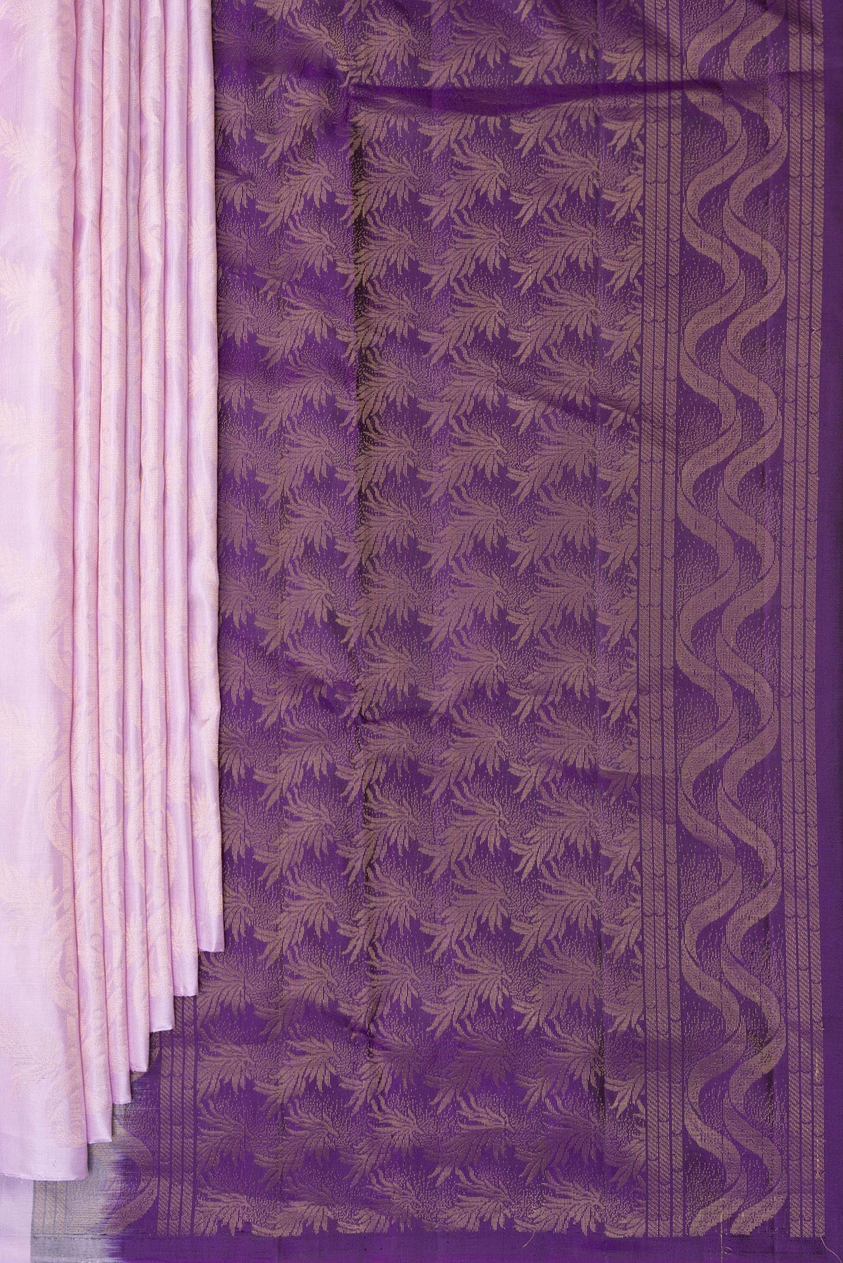 Pleats and pallu of Pure Silk Lavender Soft Saree with Zari Butta on the body and Without Border. 