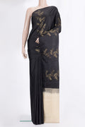 Pure Silk Black Soft Saree with Zari Butta on the body and Without Border.  displayed on a mannequin