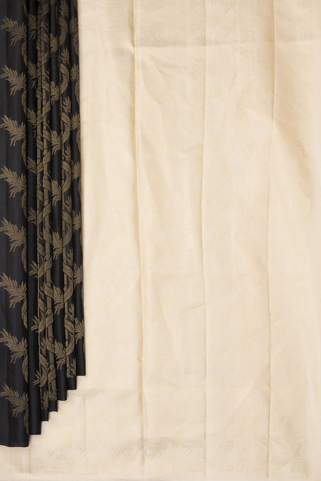 Pleats and pallu of Pure Silk Black Soft Saree with Zari Butta on the body and Without Border. 