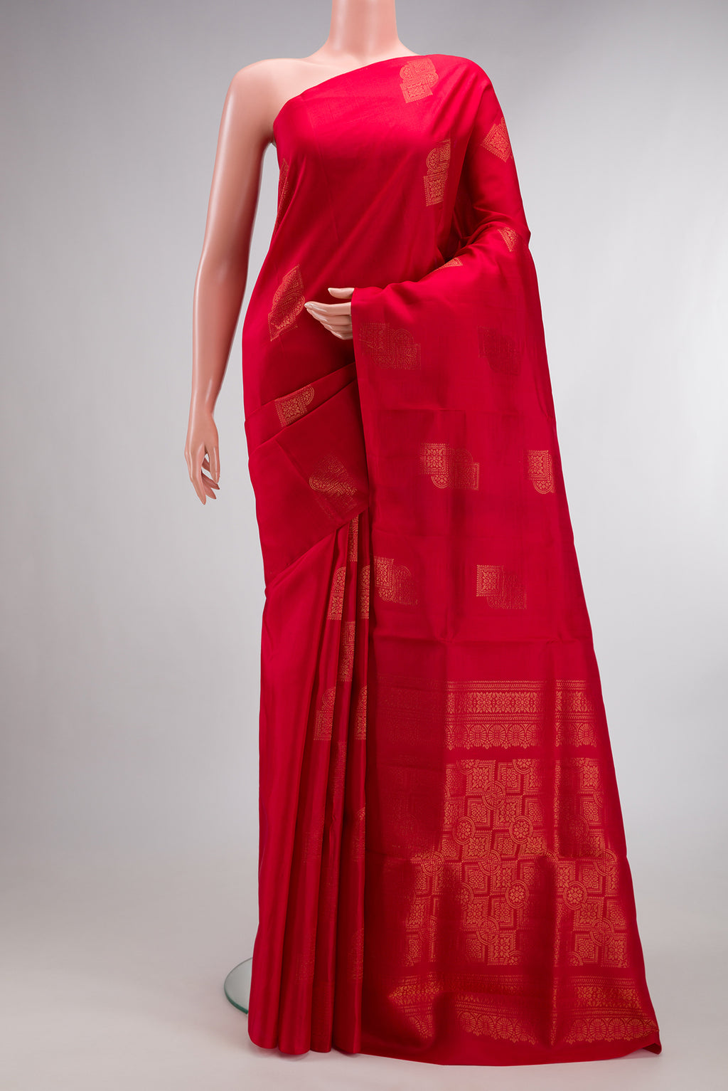 Pure Silk Red Soft Saree with Zari Butta on the body and Without Border.  displayed on a mannequin