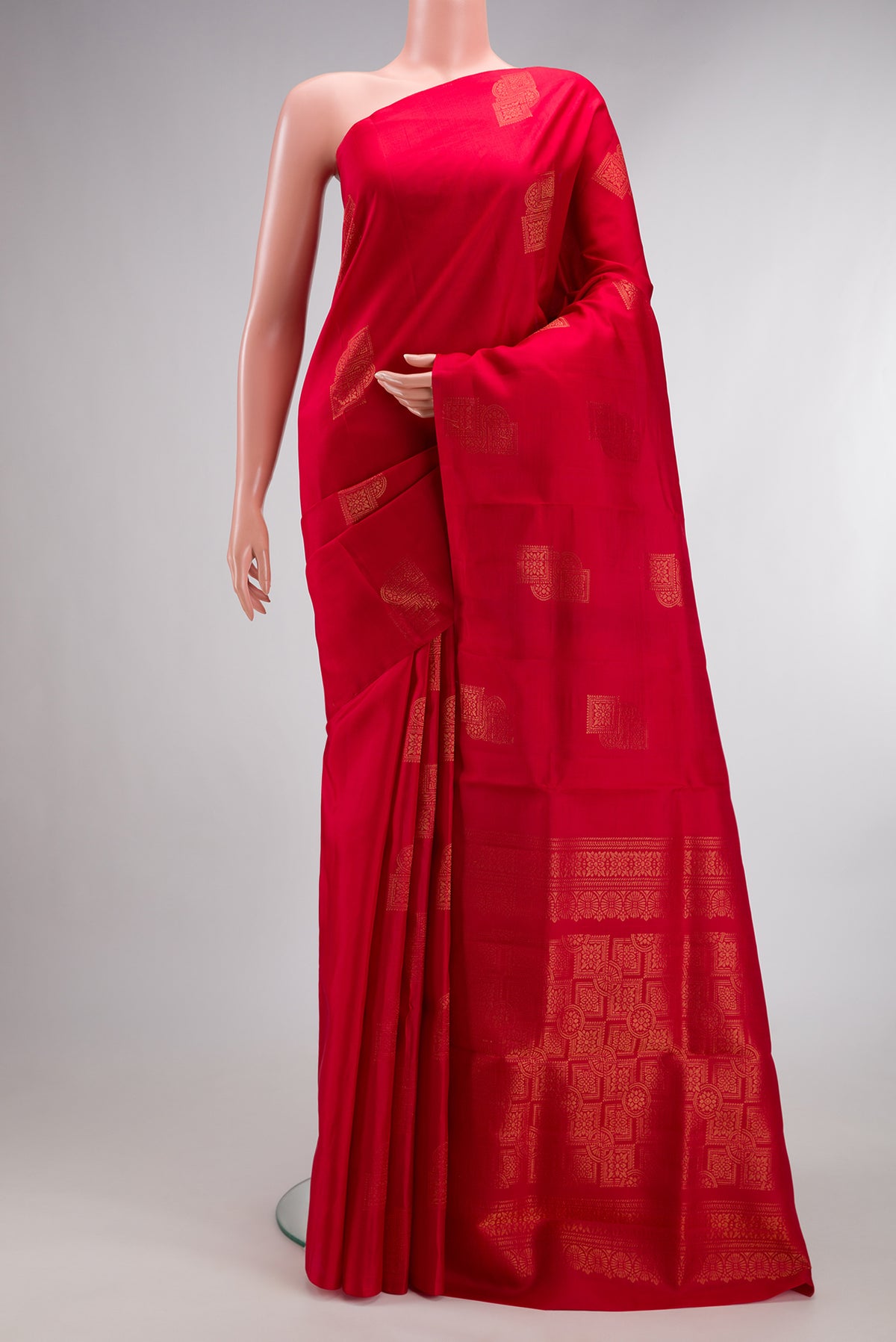 Pure Silk Red Soft Saree with Zari Butta on the body and Without Border.  displayed on a mannequin