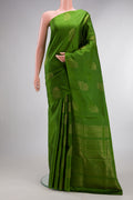 Pure Silk Green Soft Saree with Zari Butta on the body and Without Border.  displayed on a mannequin