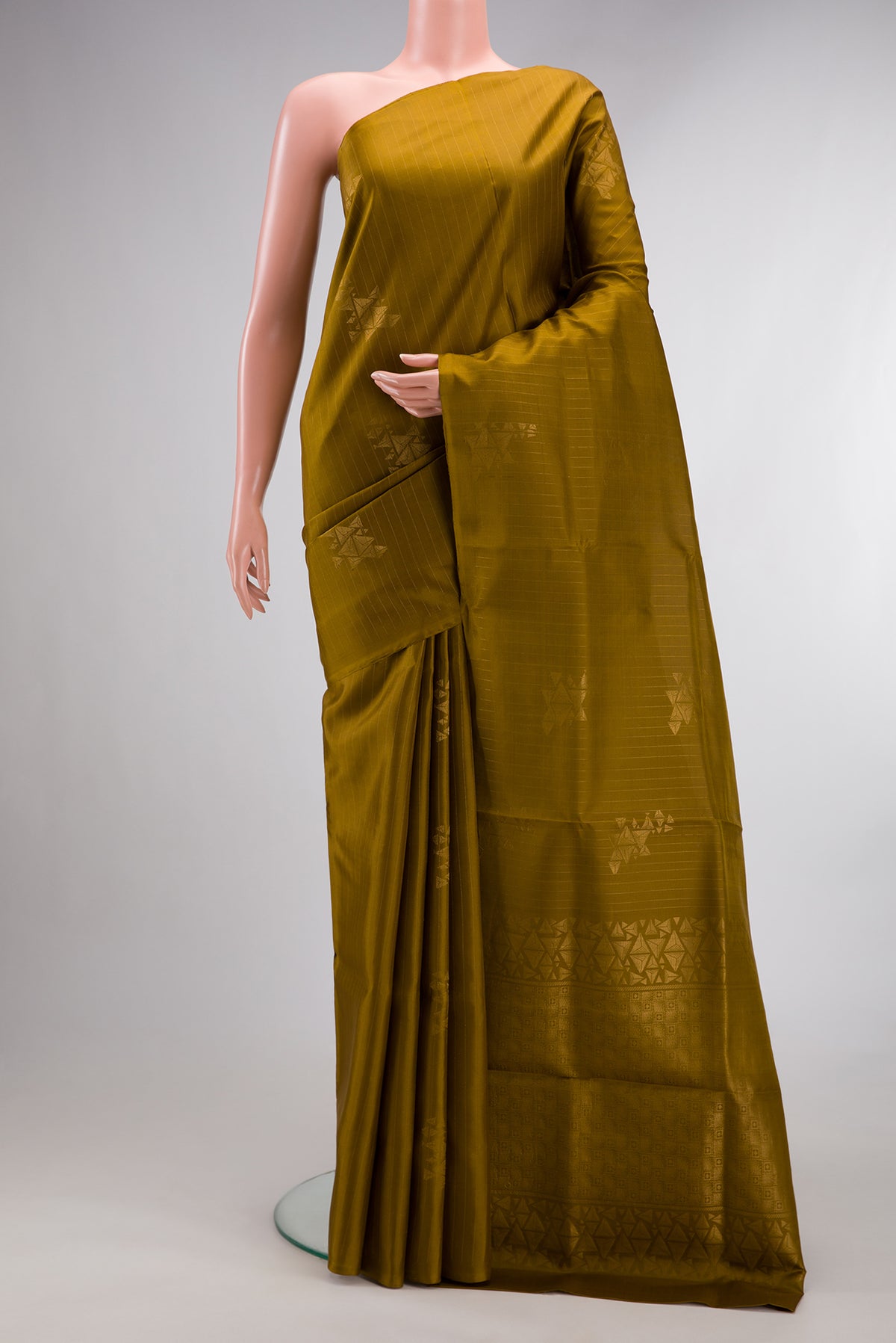 Pure Silk Mehandi Green Soft Saree with Stripes on the body and Without Border.  displayed on a mannequin