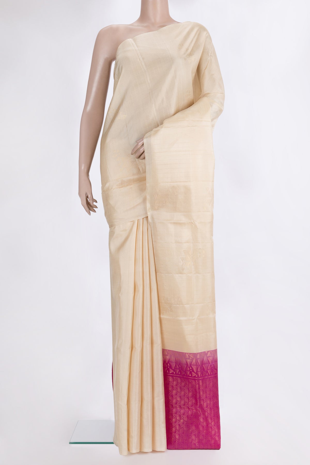 Pure Silk Beige Soft Saree with Zari Butta on the body and Without Border.  displayed on a mannequin