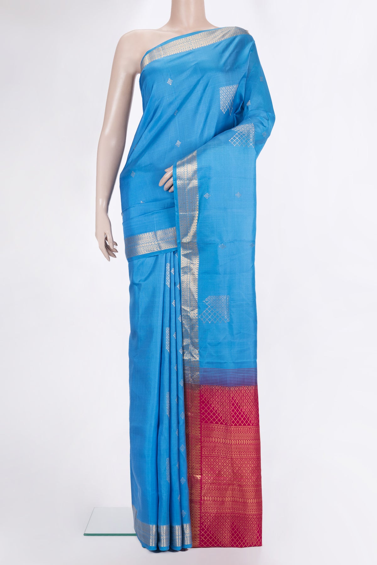 Pure Silk Sky Blue Soft Saree with Zari Butta on the body and Zari Border.  displayed on a mannequin
