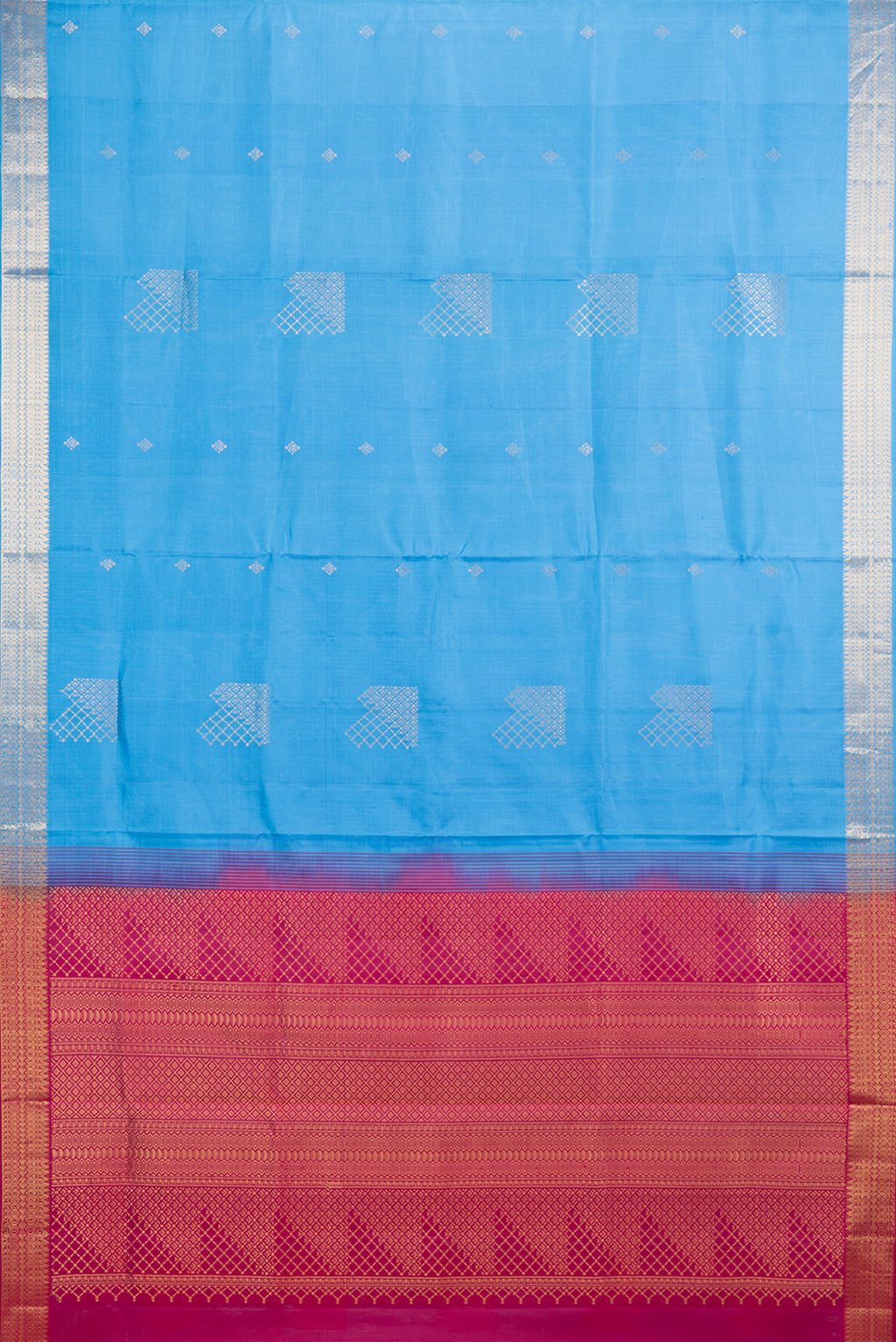 Flat view of Pure Silk Sky Blue Soft Saree with Zari Butta on the body and Zari Border. 