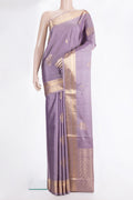 Pure Silk Lilac Soft Saree with Zari Butta on the body and Zari Border.  displayed on a mannequin