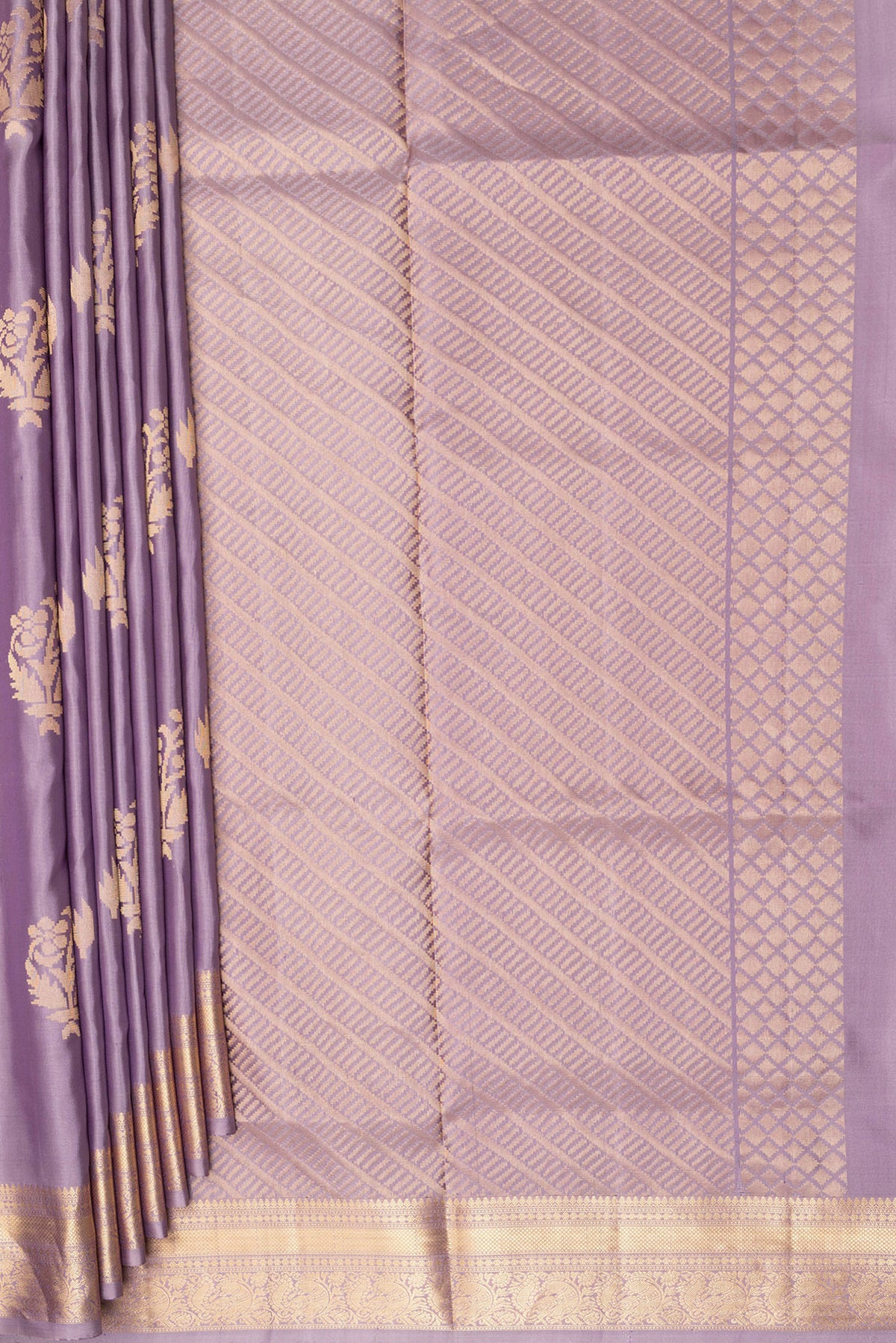 Pleats and pallu of Pure Silk Lilac Soft Saree with Zari Butta on the body and Zari Border. 