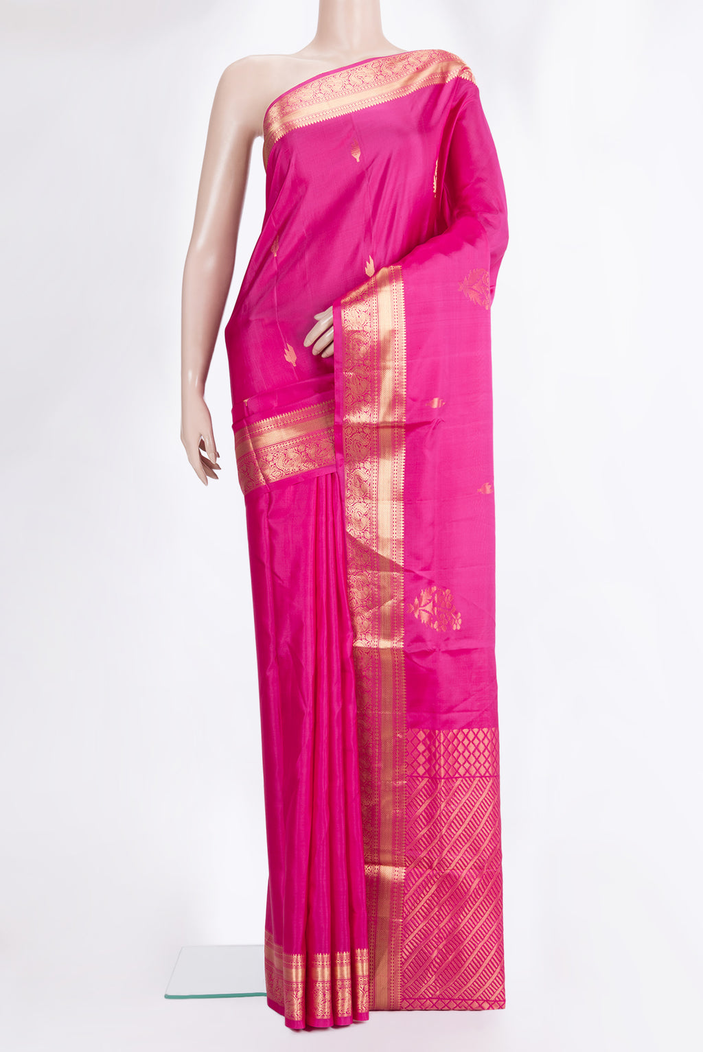 Pure Silk Dark Pink Soft Saree with Zari Butta on the body and Zari Border.  displayed on a mannequin