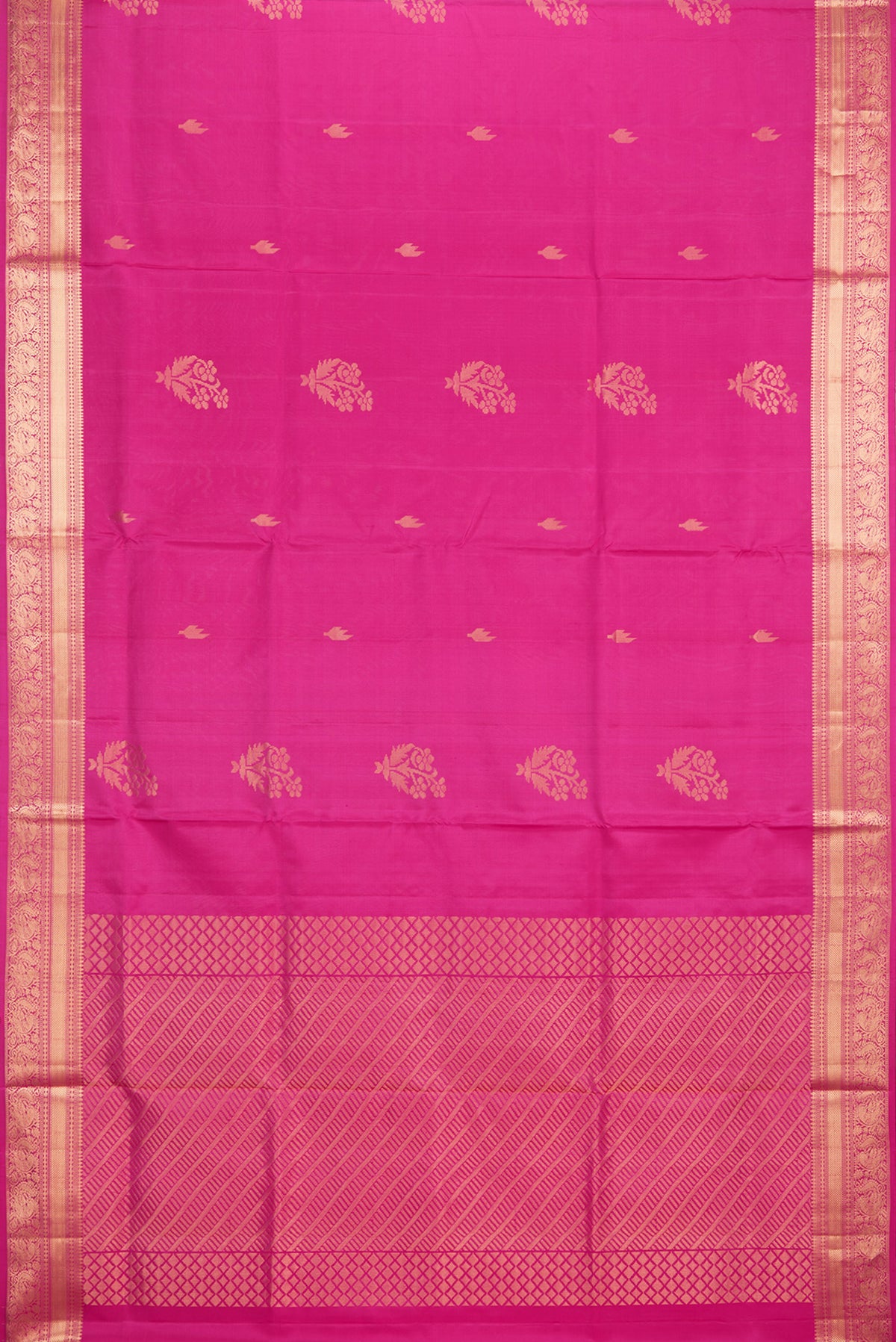 Flat view of Pure Silk Dark Pink Soft Saree with Zari Butta on the body and Zari Border. 