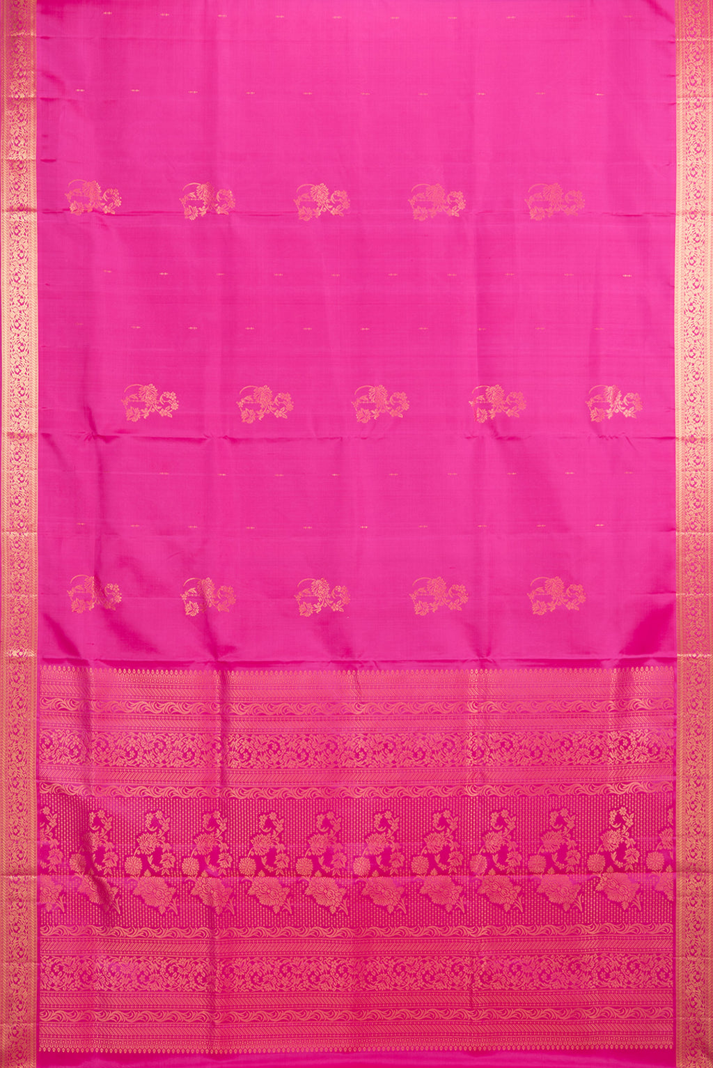 Flat view of Pure Silk Rani Pink Soft Saree with Zari Butta on the body and Zari Border. 