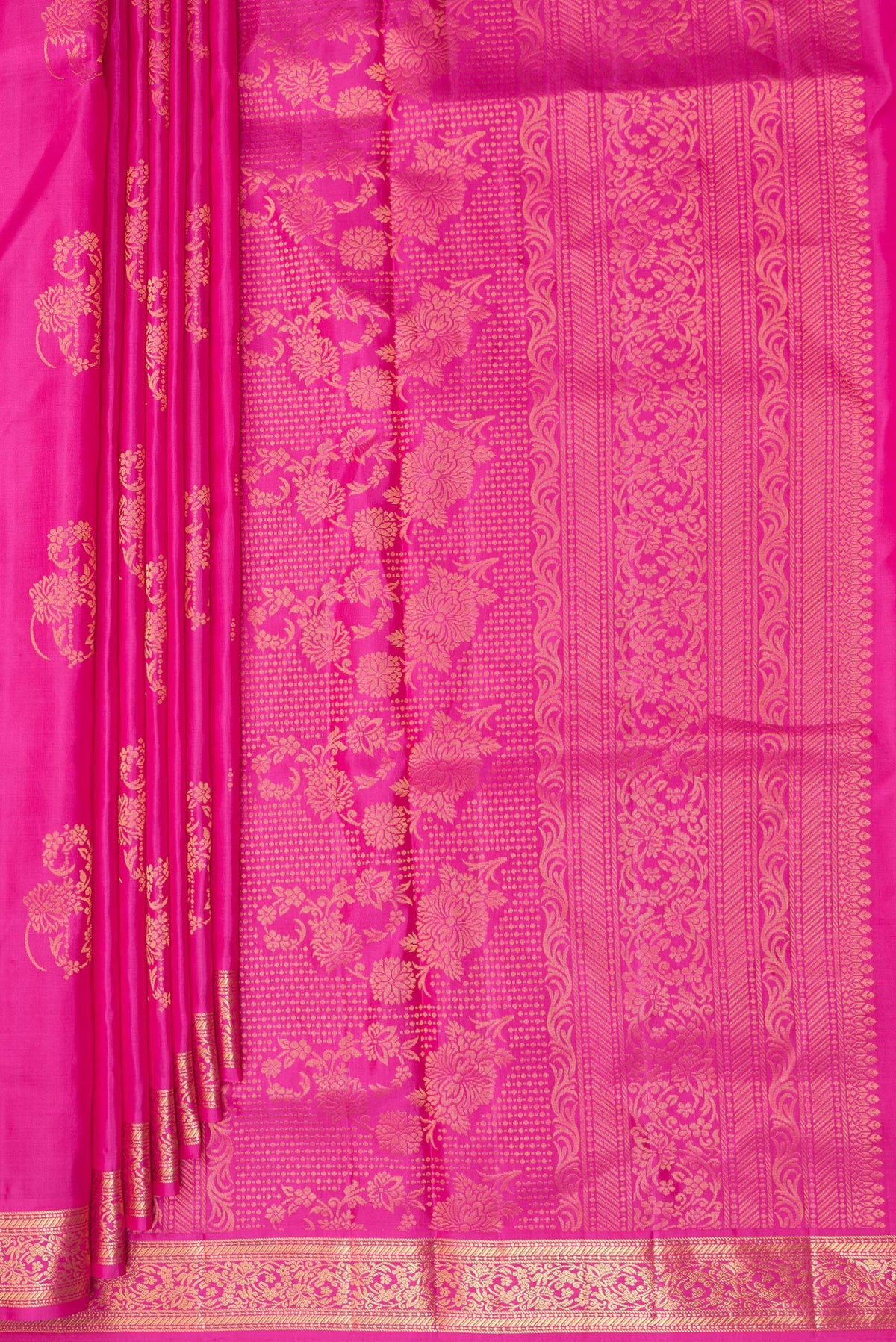 Pleats and pallu of Pure Silk Rani Pink Soft Saree with Zari Butta on the body and Zari Border. 