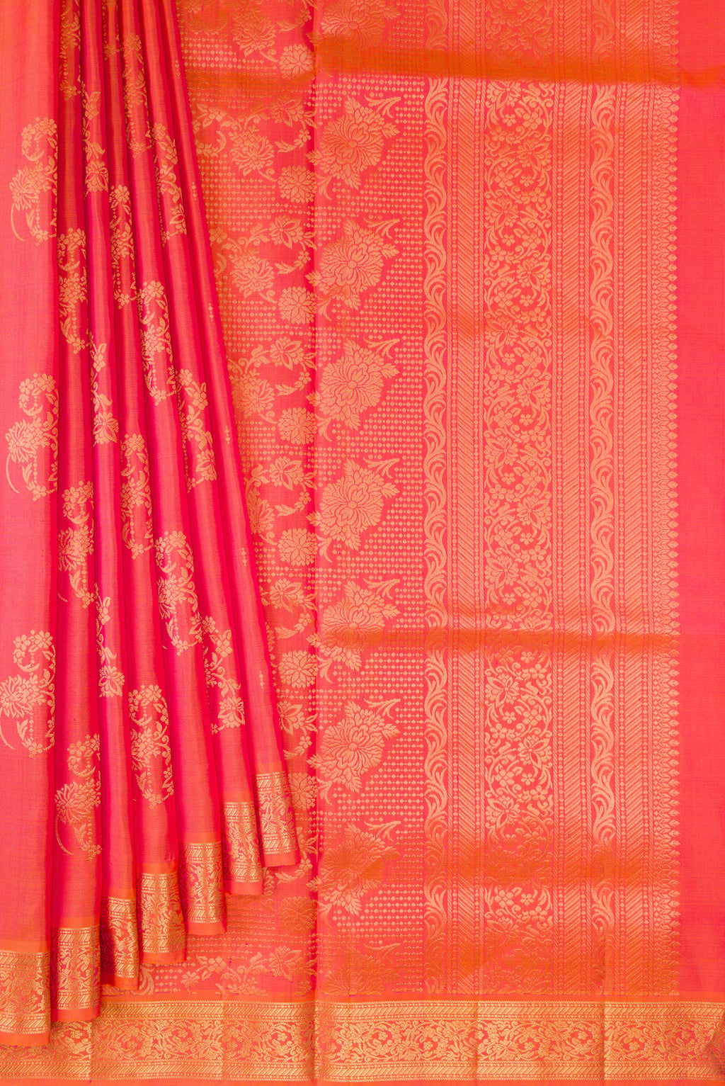 Pleats and pallu of Pure Silk Coral Dual Tone Soft Saree with Zari Butta on the body and Zari Border. 
