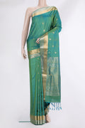 Pure Silk Turquoise Dual Tone Soft Saree with Zari Butta on the body and Zari Border.  displayed on a mannequin