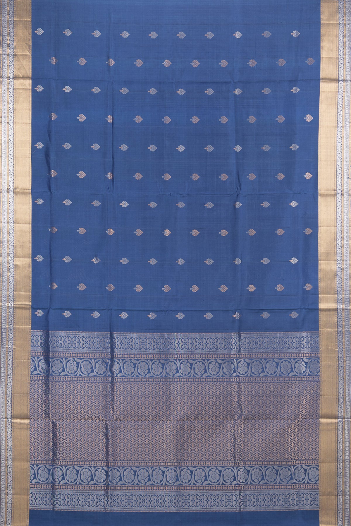 Flat view of Pure Silk Blue Soft Saree with Zari Butta on the body and Zari Border. 