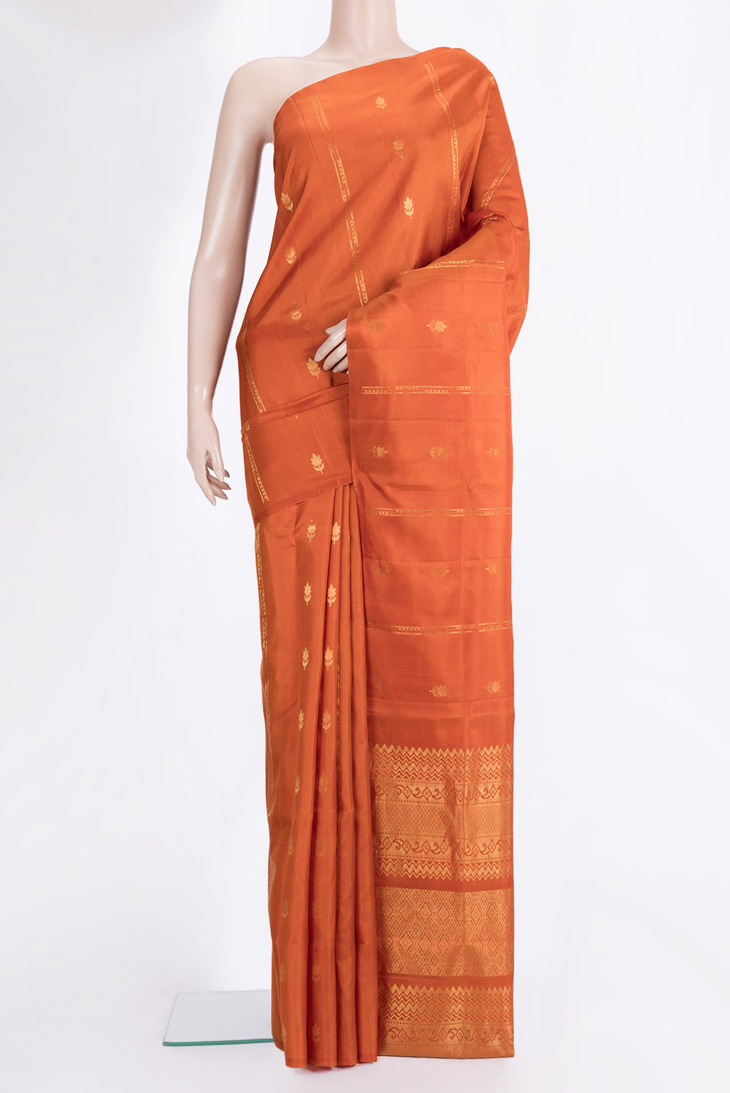 Pure Silk Rust Dual Tone Soft Saree with Stripes on the body and Without Border.  displayed on a mannequin