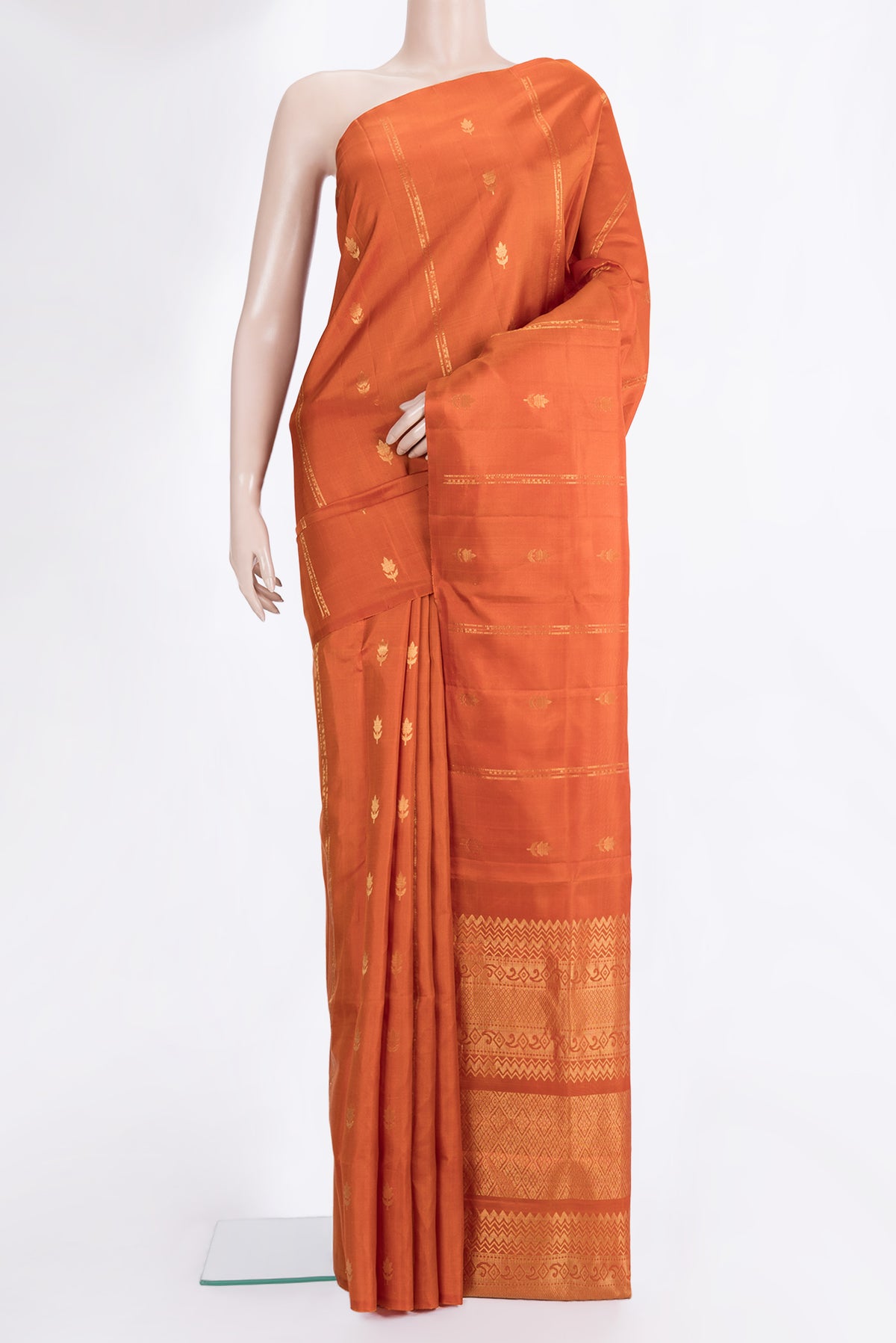 Pure Silk Rust Dual Tone Soft Saree with Stripes on the body and Without Border.  displayed on a mannequin
