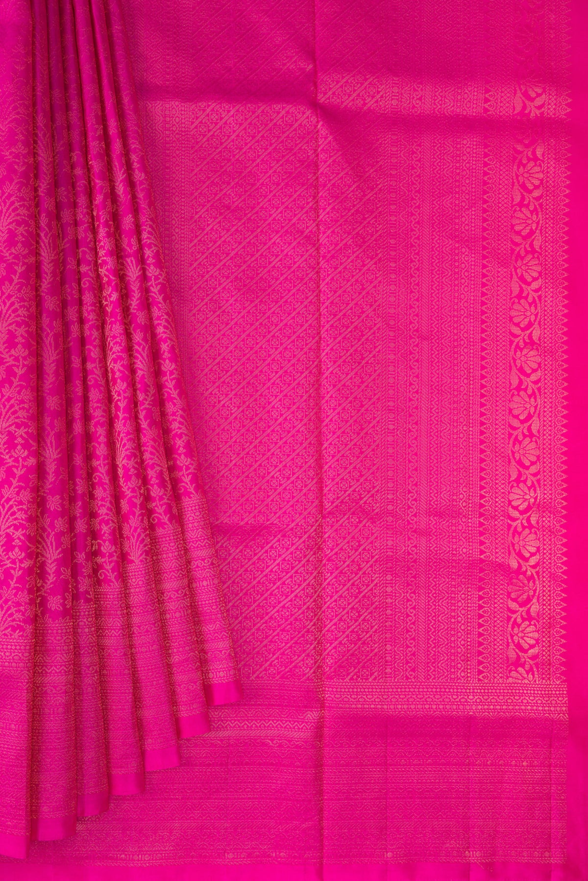 Pleats and pallu of Pure Silk Rani Pink Soft Saree with Zari Brocade on the body and Fancy Border. 