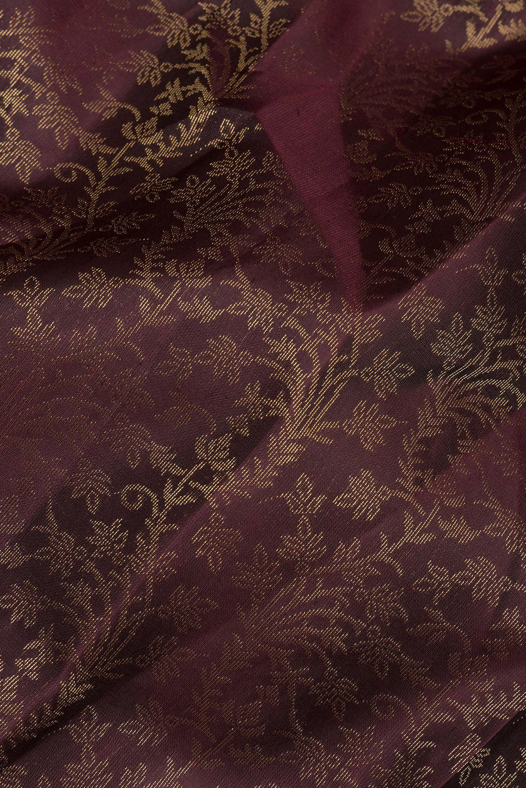 Close up of Pure Silk Coffee Brown Soft Saree with Zari Brocade on the body and Fancy Border.  displaying folds