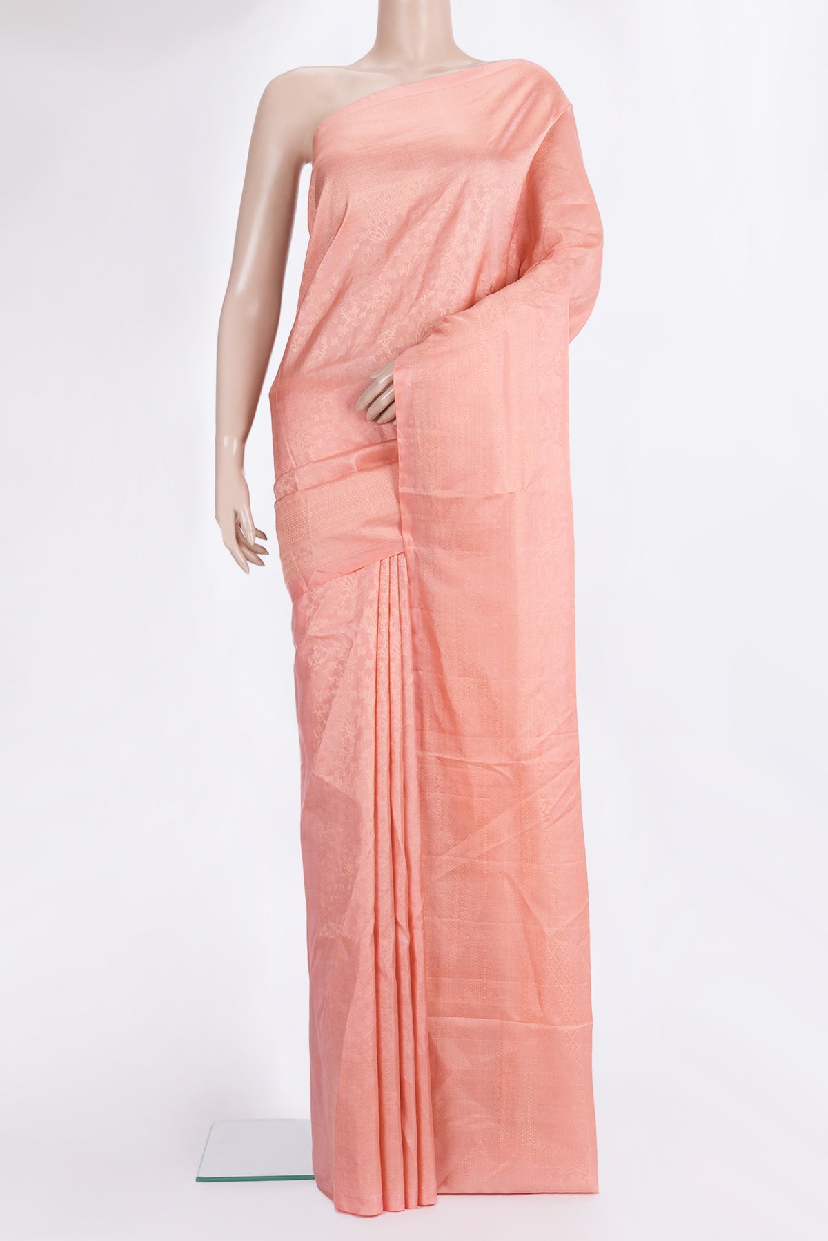 Pure Silk Peach Soft Saree with Zari Brocade on the body and Fancy Border.  displayed on a mannequin