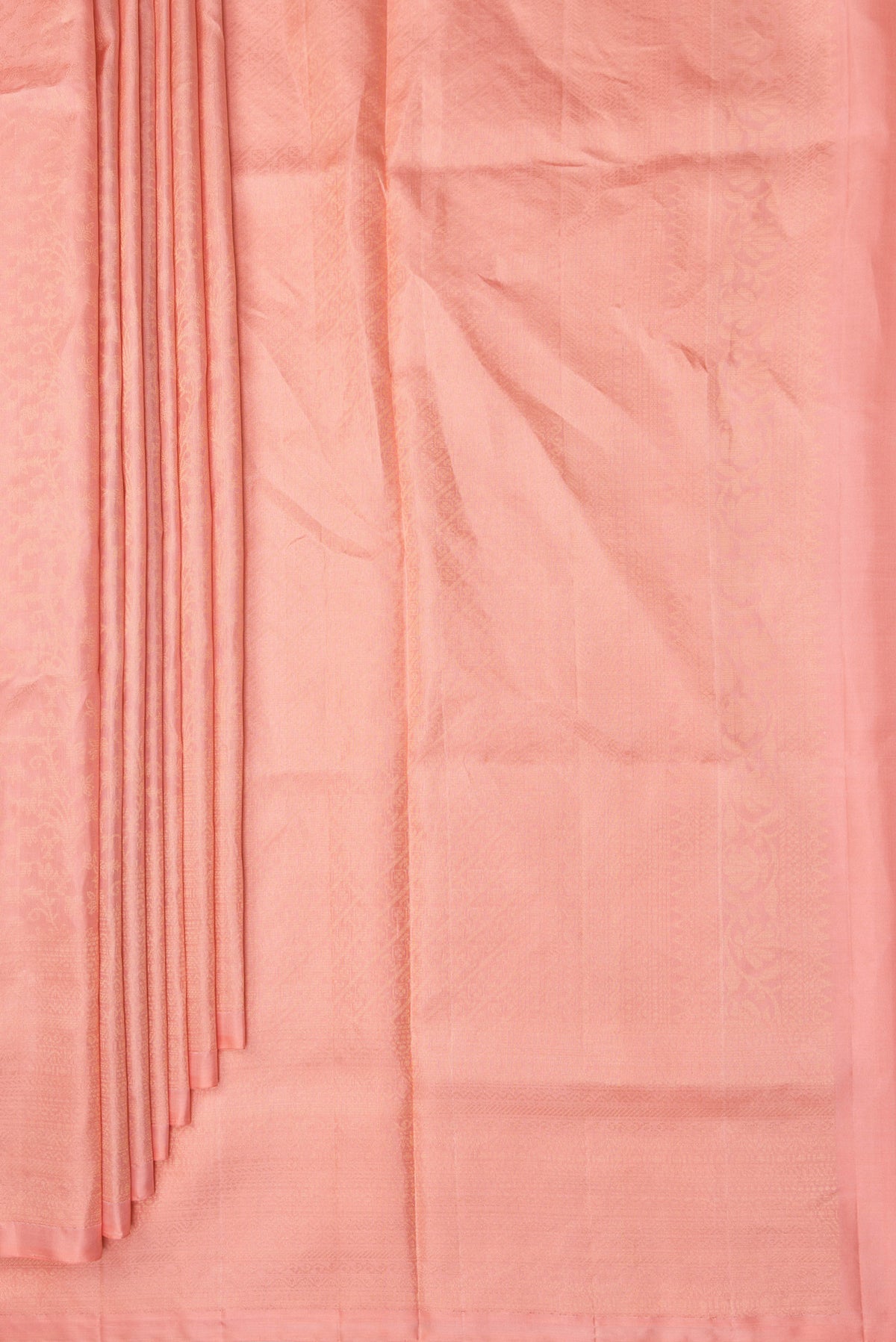 Pleats and pallu of Pure Silk Peach Soft Saree with Zari Brocade on the body and Fancy Border. 