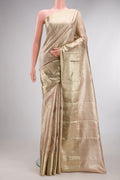 Gold Dual Tone Kanjivaram Tissue Saree with Zari Brocade on the body and Zari Border.  displayed on a mannequin
