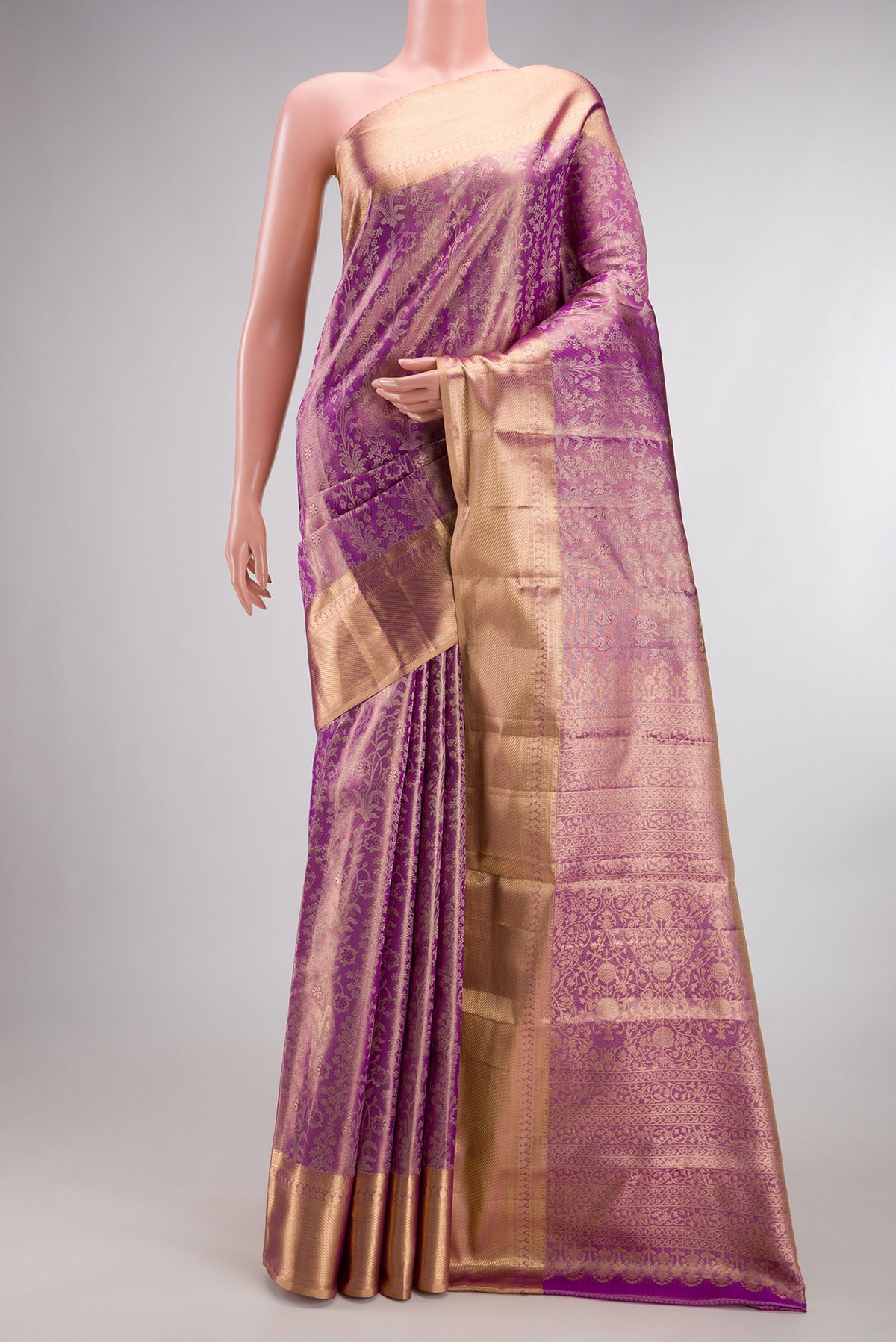 Light Magenta Dual Tone Kanjivaram Tissue Saree with Zari Brocade on the body and Zari Border.  displayed on a mannequin