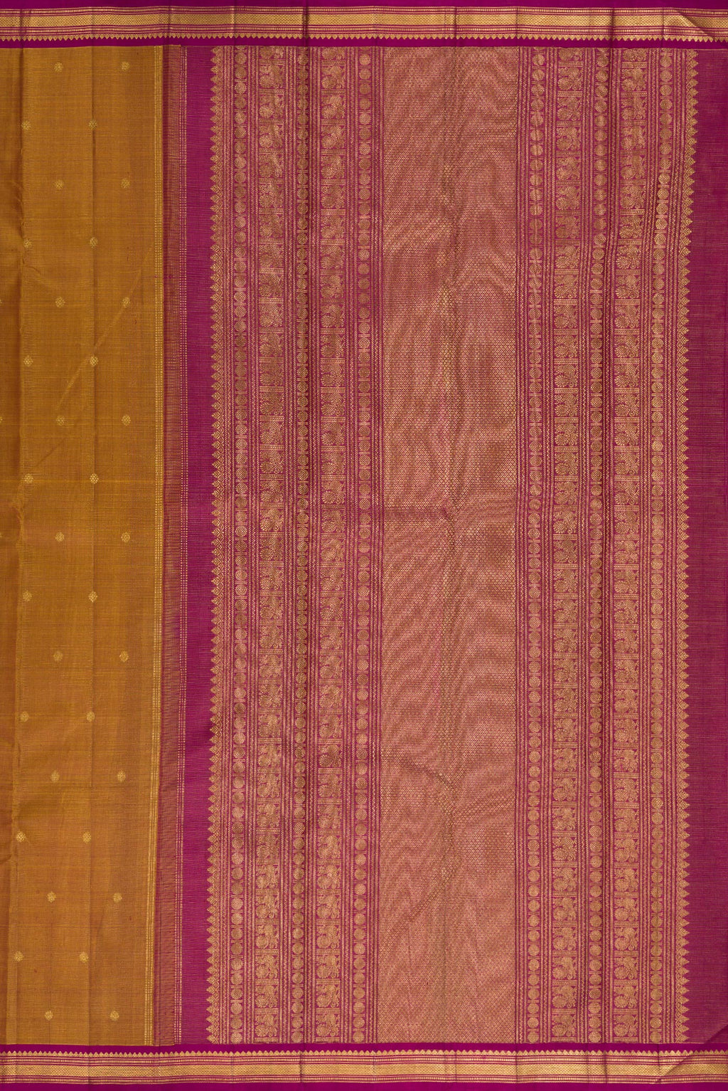 Close up image of the pallu of Pure Silk Mustard Kanjivaram Saree with Zari Butta on the body and Zari Border. 