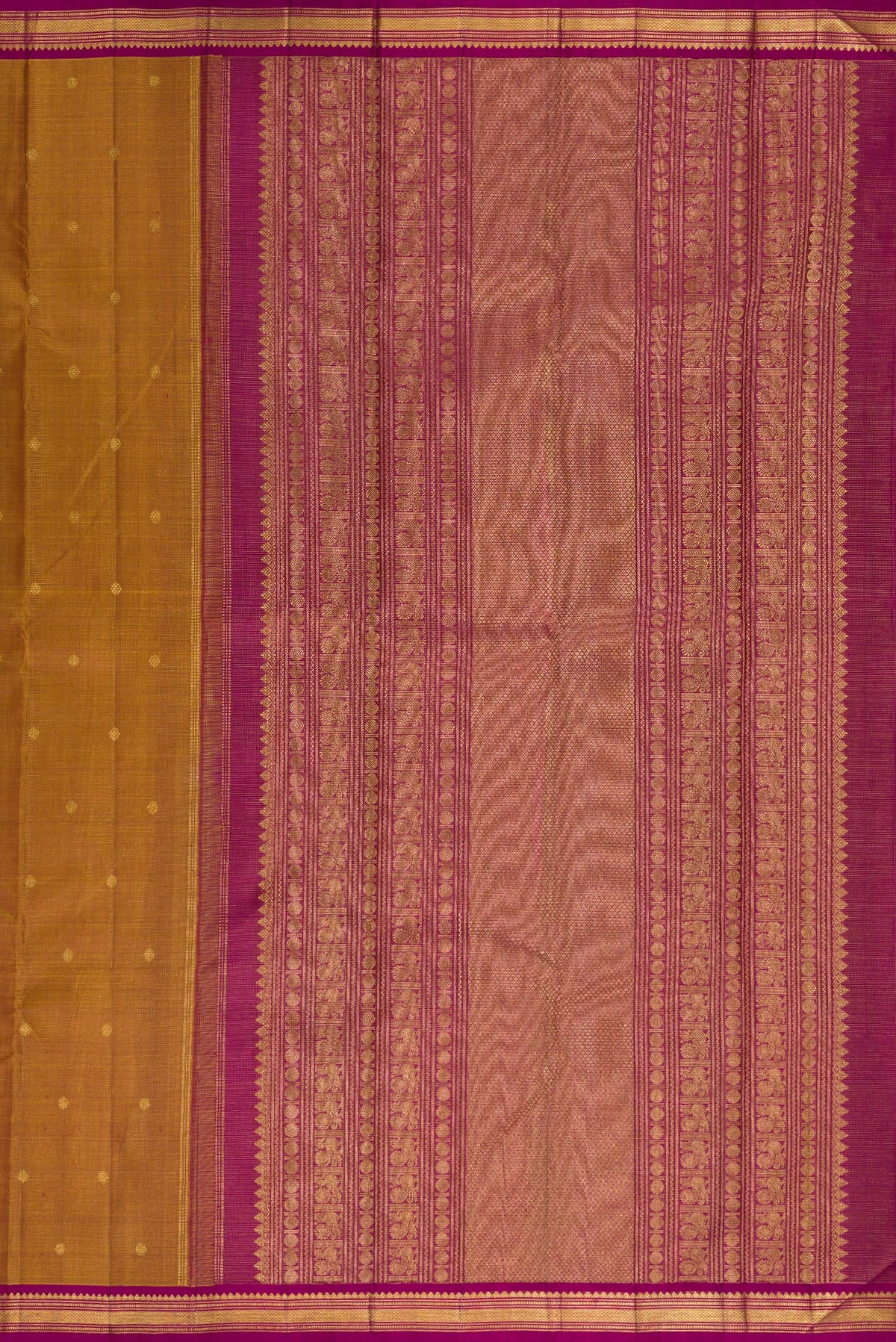 Close up image of the pallu of Pure Silk Mustard Kanjivaram Saree with Zari Butta on the body and Zari Border. 