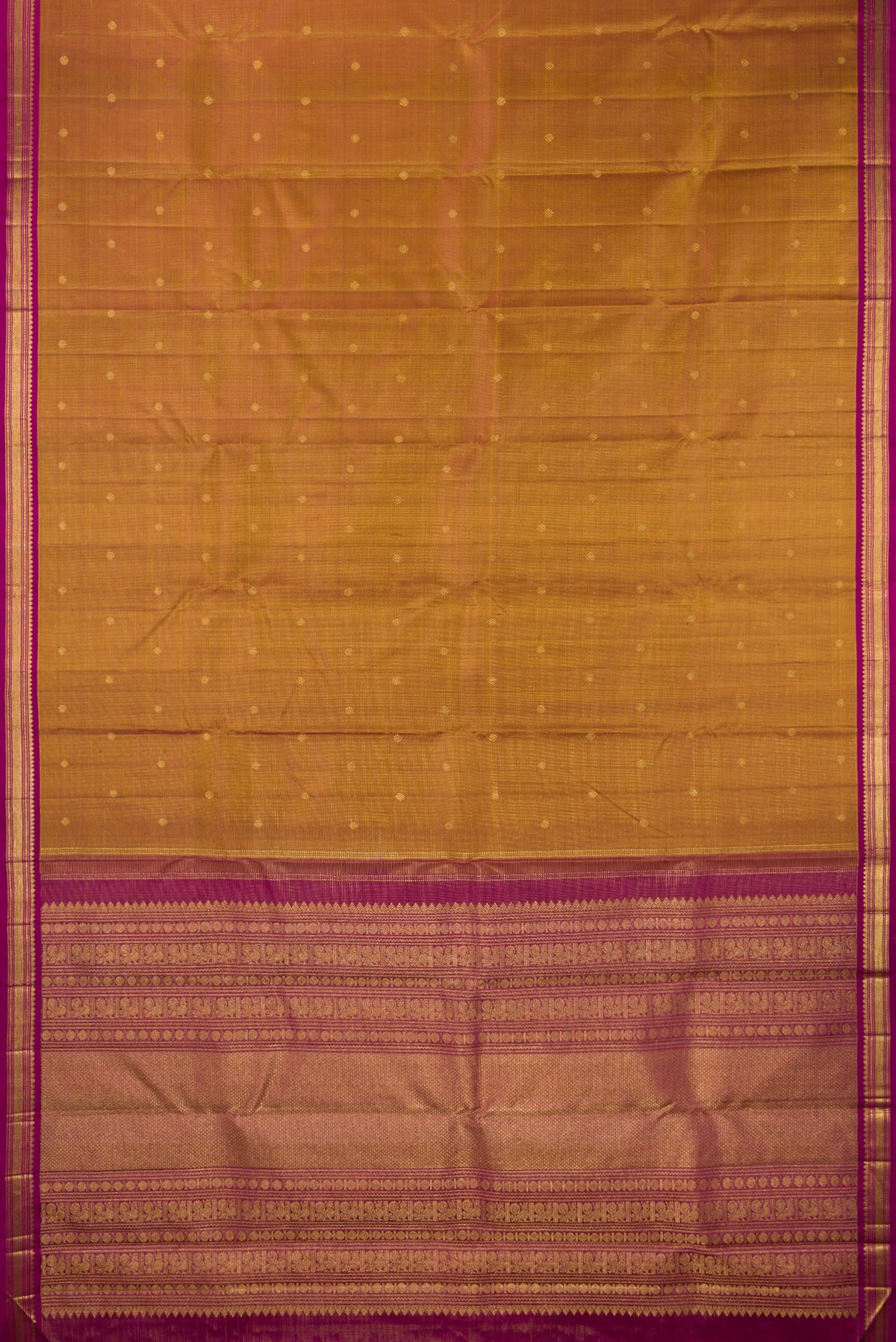 Flat view of Pure Silk Mustard Kanjivaram Saree with Zari Butta on the body and Zari Border. 