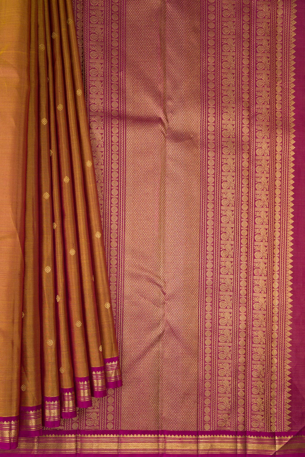 Pleats and pallu of Pure Silk Mustard Kanjivaram Saree with Zari Butta on the body and Zari Border. 