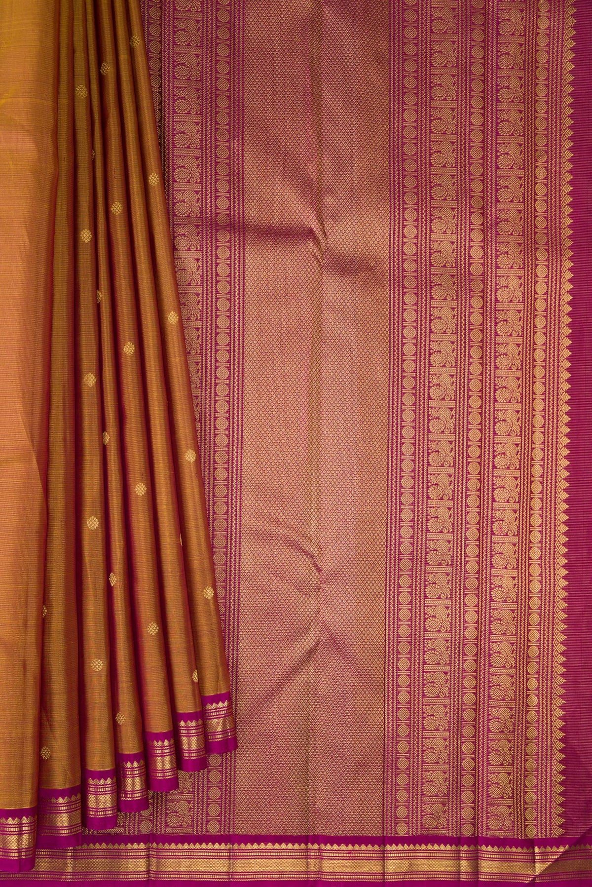 Pleats and pallu of Pure Silk Mustard Kanjivaram Saree with Zari Butta on the body and Zari Border. 